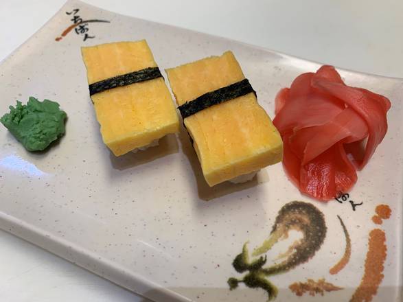 Order Tamago Nigiri Sushi (2 pcs) food online from Inari Sushi store, Rockville on bringmethat.com