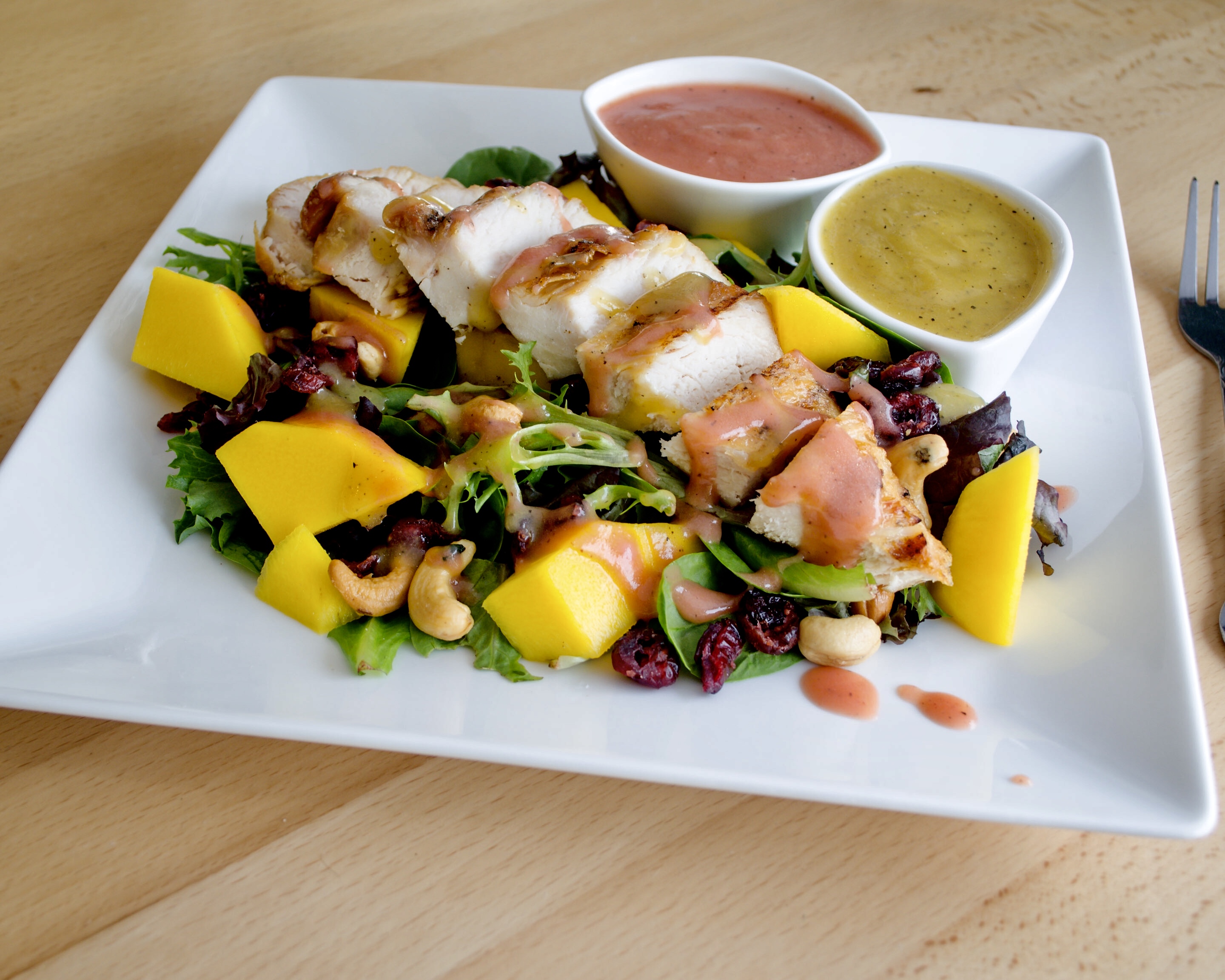 Order Tropical Chicken & Mango Salad - Pollo & Mango food online from Sweets & Cortaditos store, Belleville on bringmethat.com