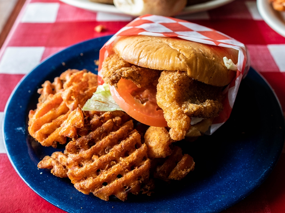 Order Catfish Sandwich- Grilled or Fried food online from The Texan Cafe & Pie Shop store, Hutto on bringmethat.com