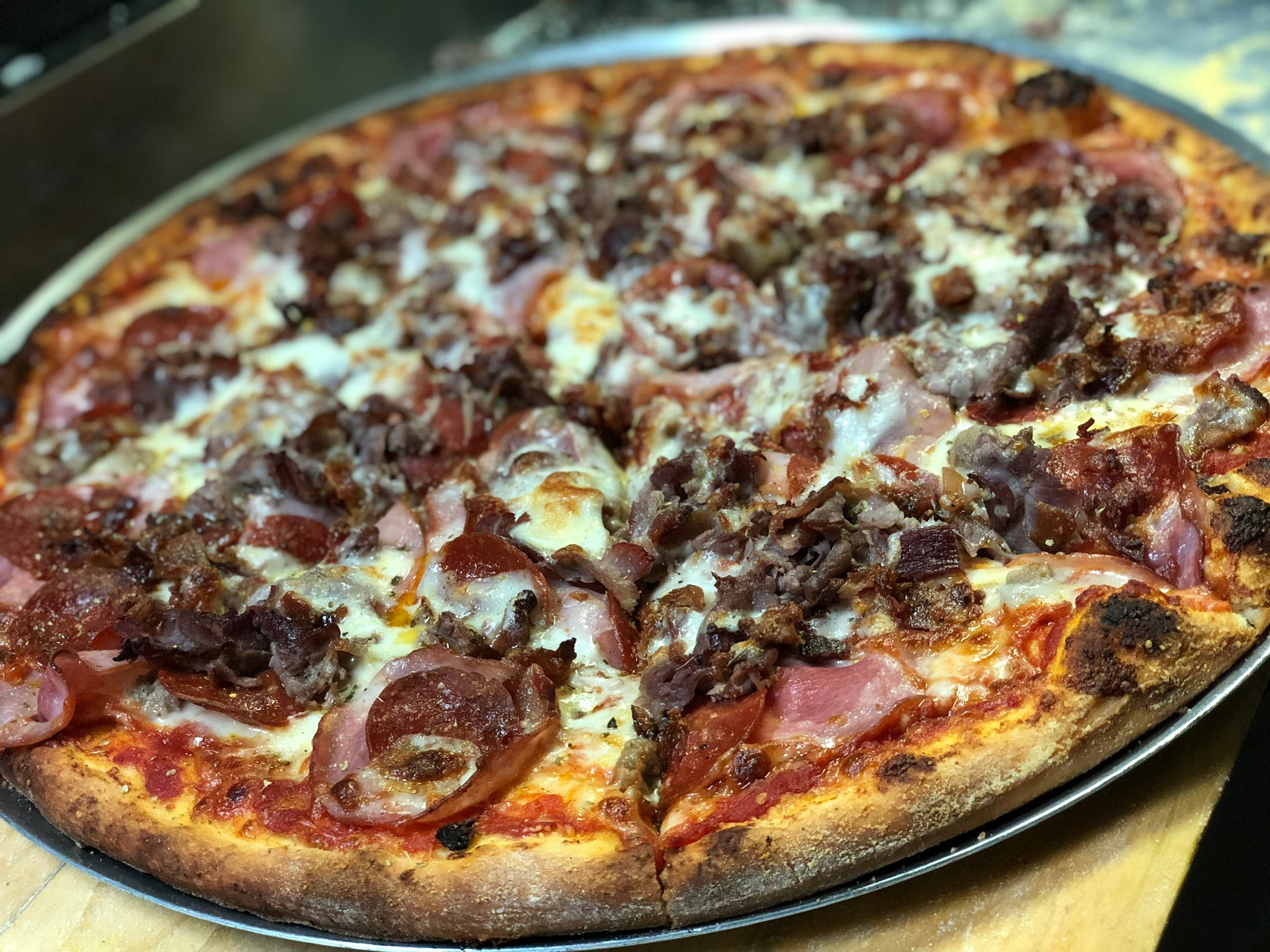 Order Meat Lovers Pizza - Large 16" food online from Johnny's Bar & Grill store, Sterling on bringmethat.com