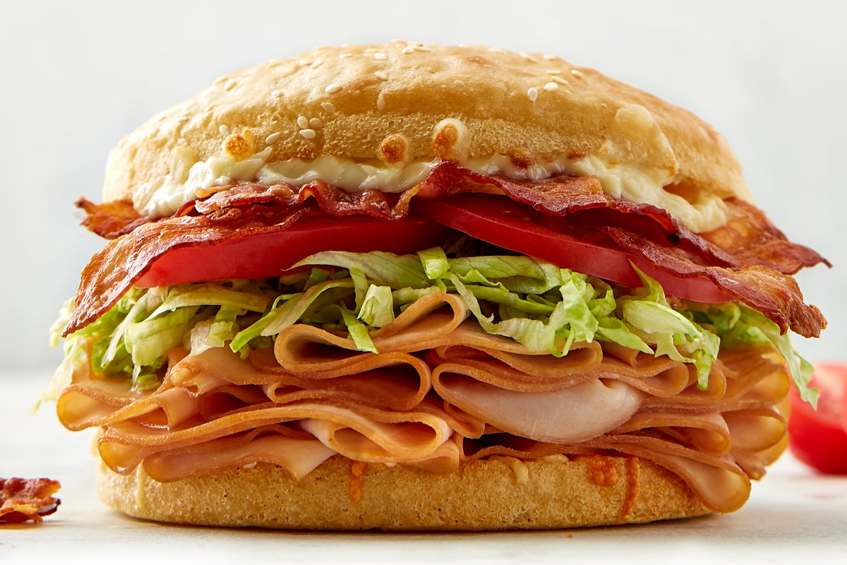 Order Turkey Bacon Club Sandwich food online from Schlotzskys Deli store, Round Rock on bringmethat.com
