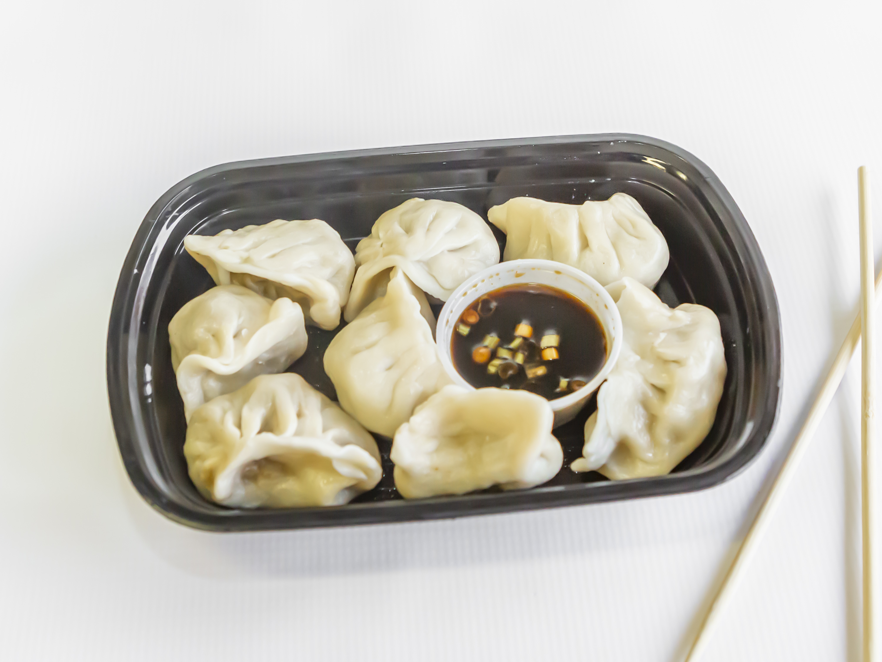 Order 4. Steamed Dumplings food online from Panda Chinese Restaurant store, Toledo on bringmethat.com