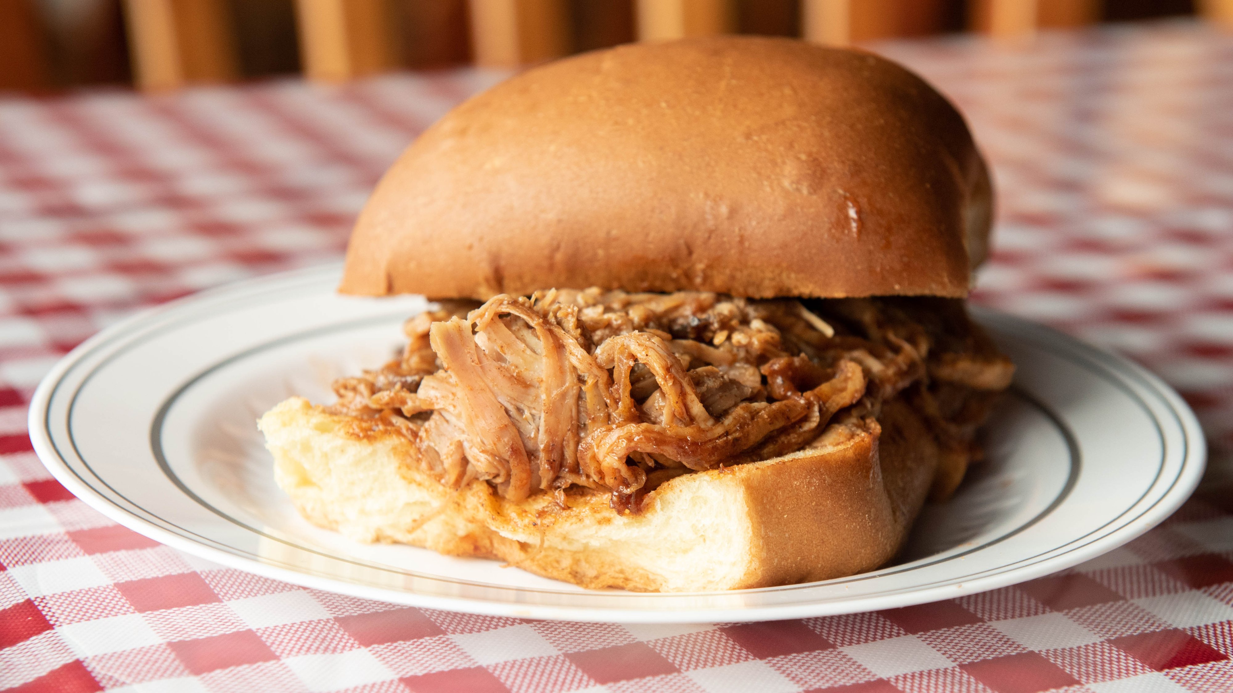 Order Smoked Pulled Pork Sandwich food online from Russell's Barbecue store, Elmwood Park on bringmethat.com