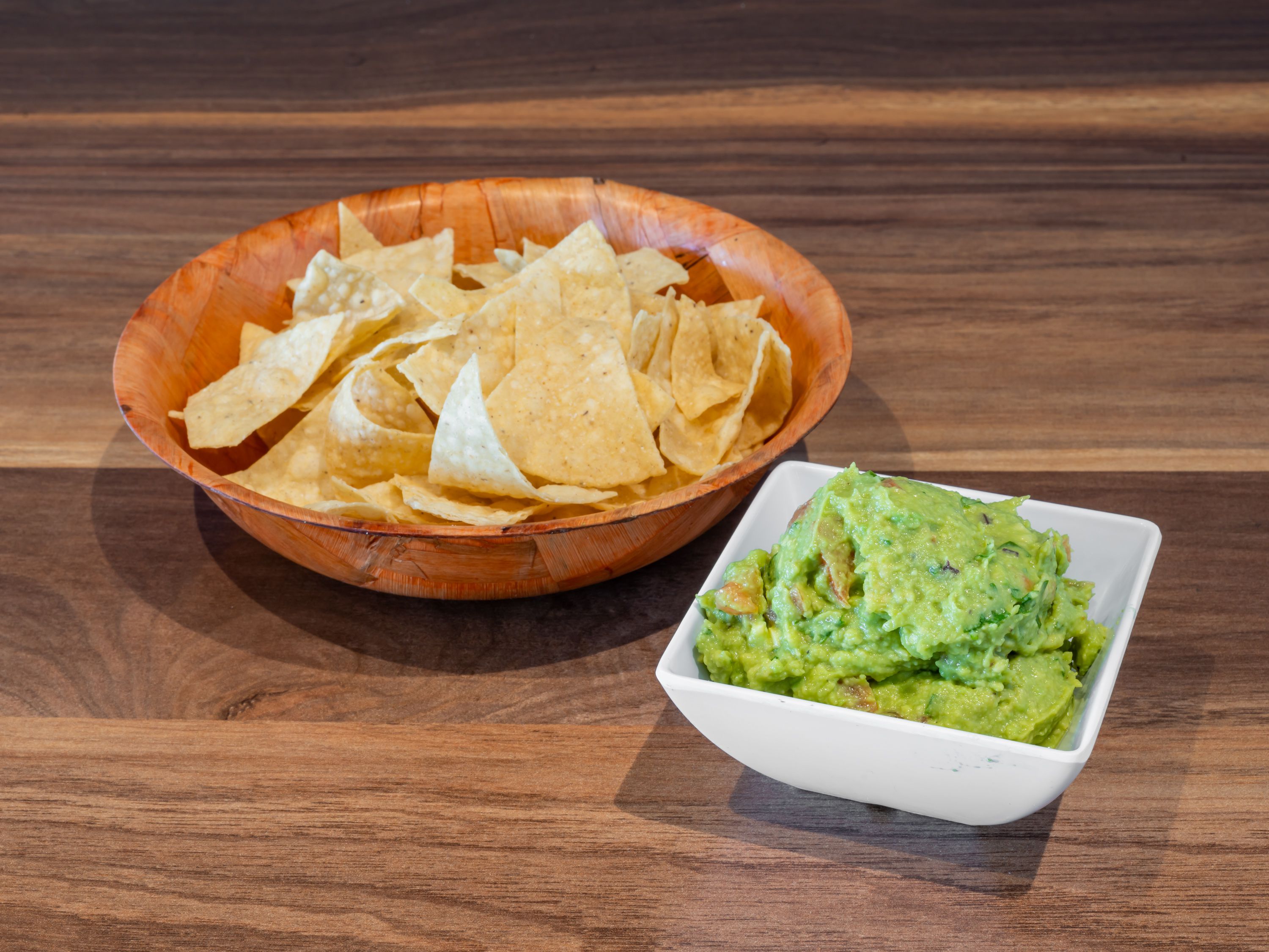 Order Chips and Guac food online from Veganixima store, Orange on bringmethat.com