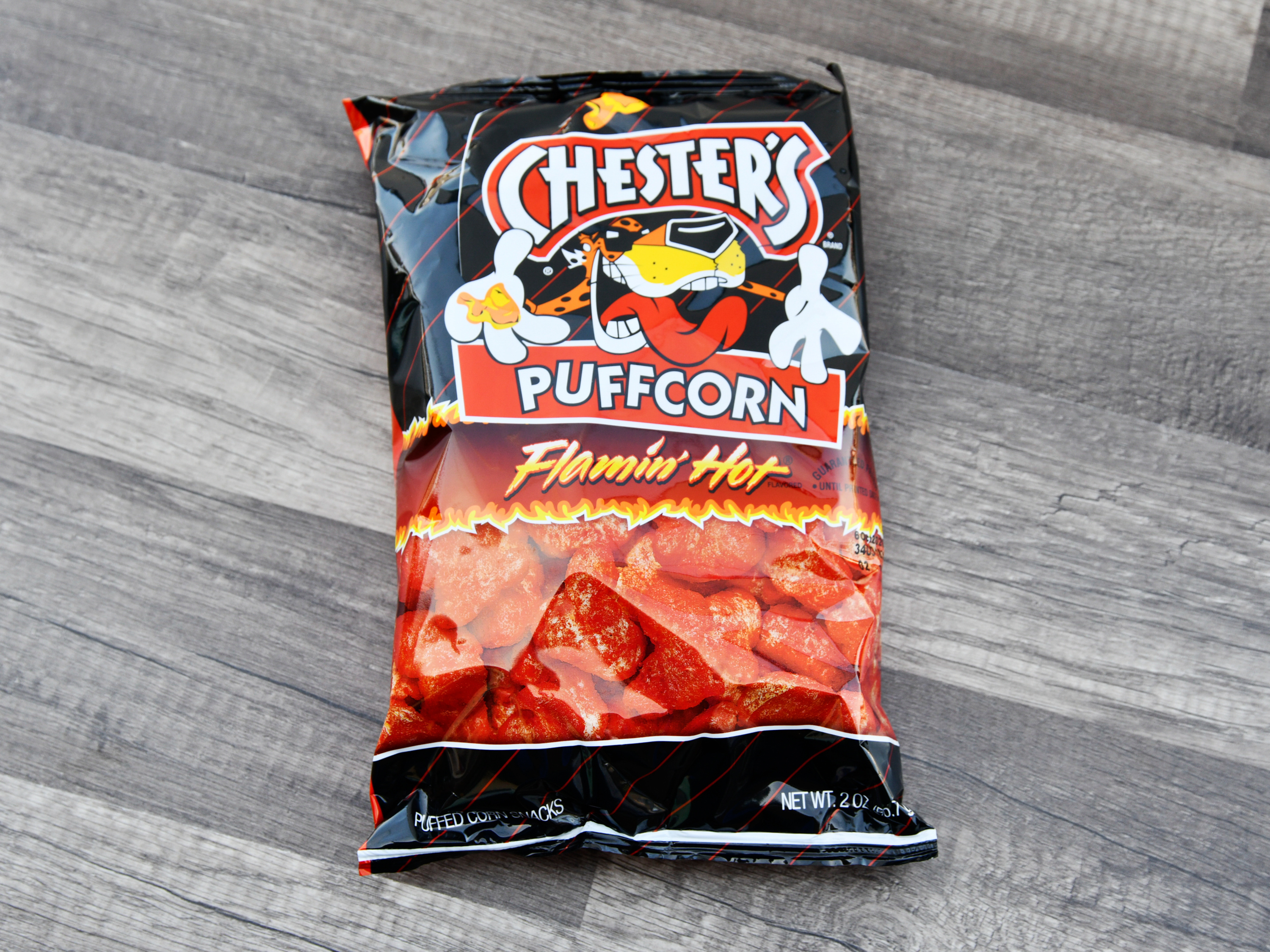Order 2 oz. Chester's Puffcorn Flamin Hot food online from Iris Shop store, Los Angeles on bringmethat.com
