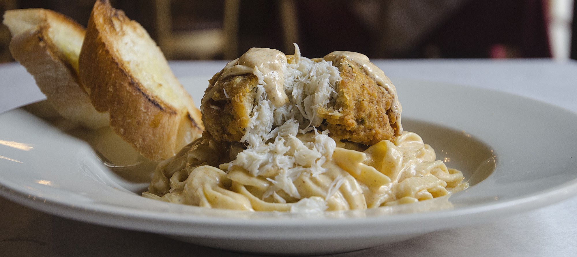 Order Crab Cake Pasta food online from Mambo store, New Orleans on bringmethat.com