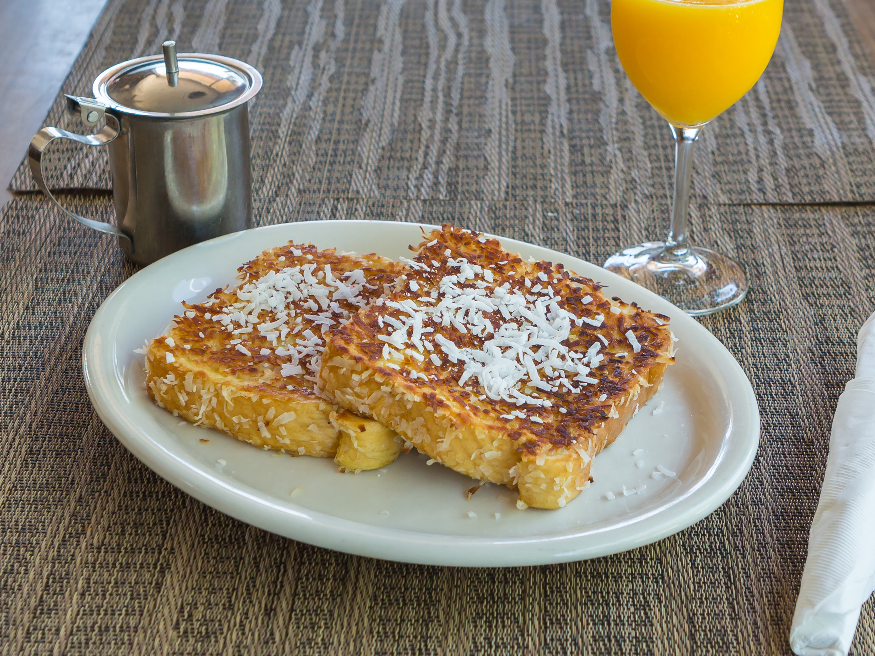 Order Coconut French Toast food online from Al Cafe In The Village store, Carlsbad on bringmethat.com