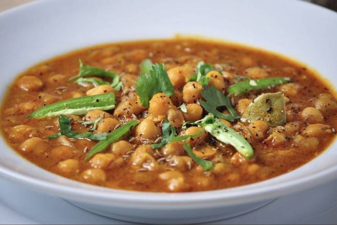 Order Chana Masala  (with Basmati Rice or Naan) food online from House of curries store, Berkeley on bringmethat.com