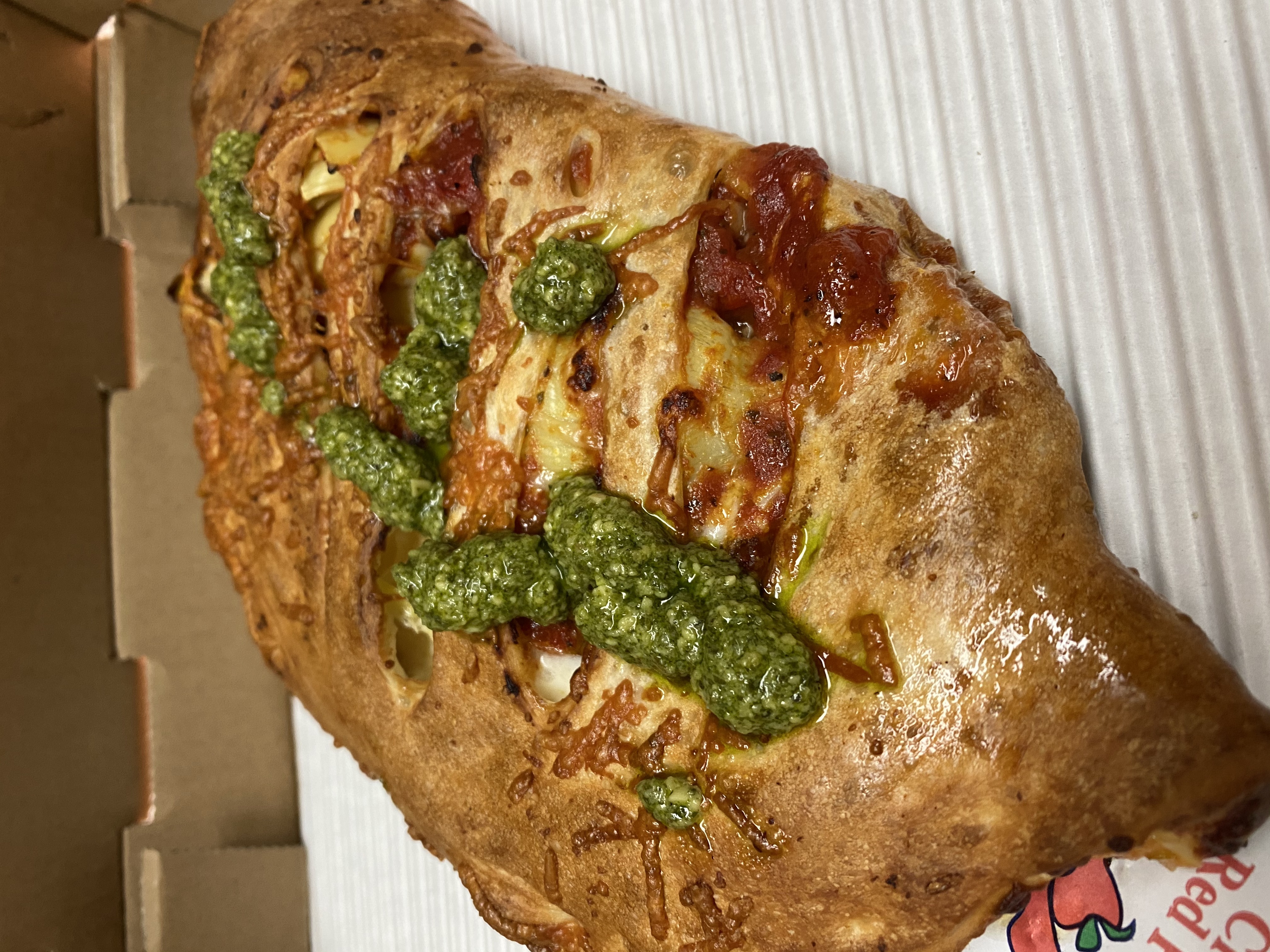 Order W.O.W. Calzone (T) food online from Razzis Pizzeria store, Seattle on bringmethat.com