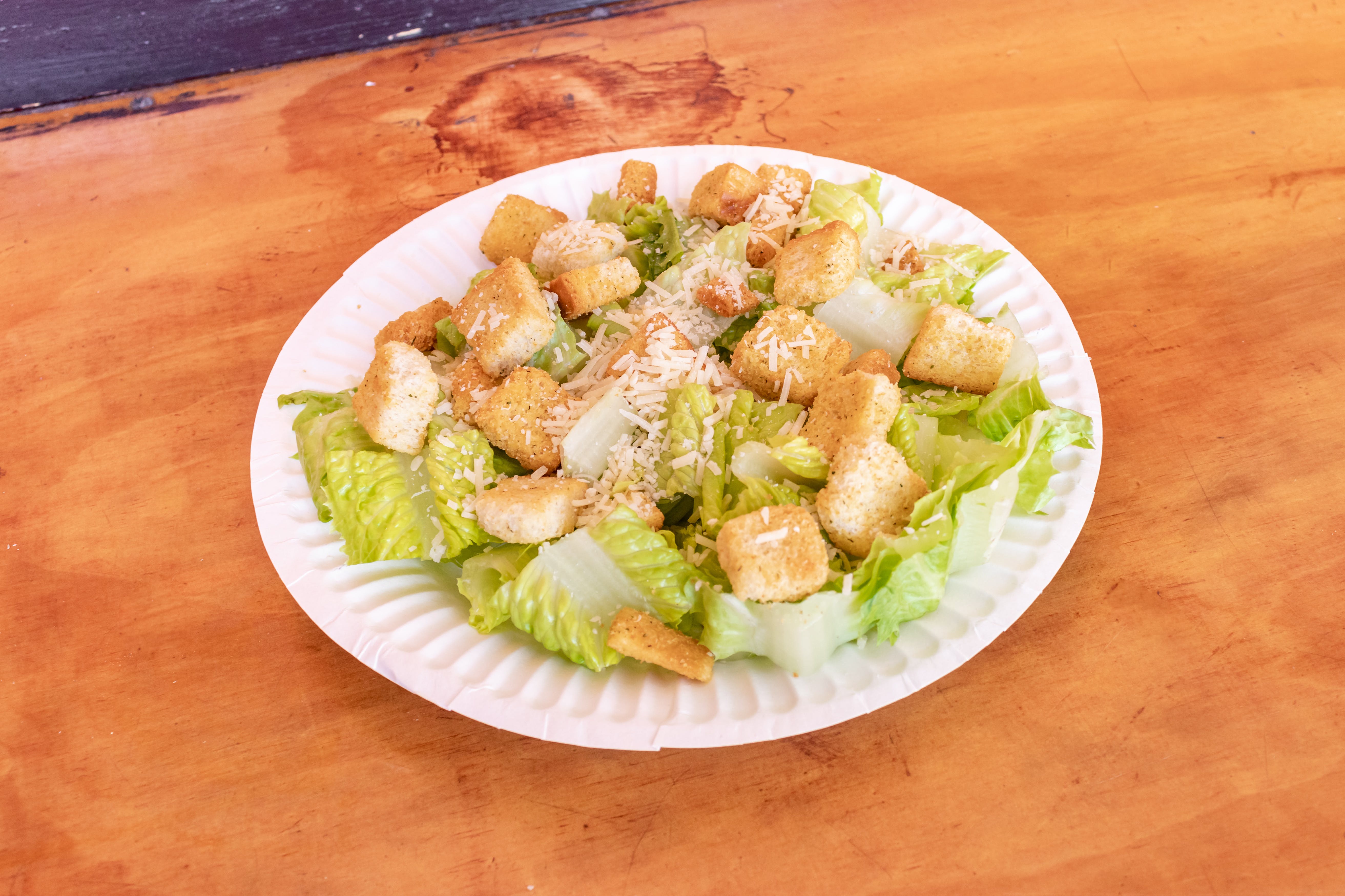 Order Caesar Salad - Salad food online from Chicos Pizza store, San Francisco on bringmethat.com