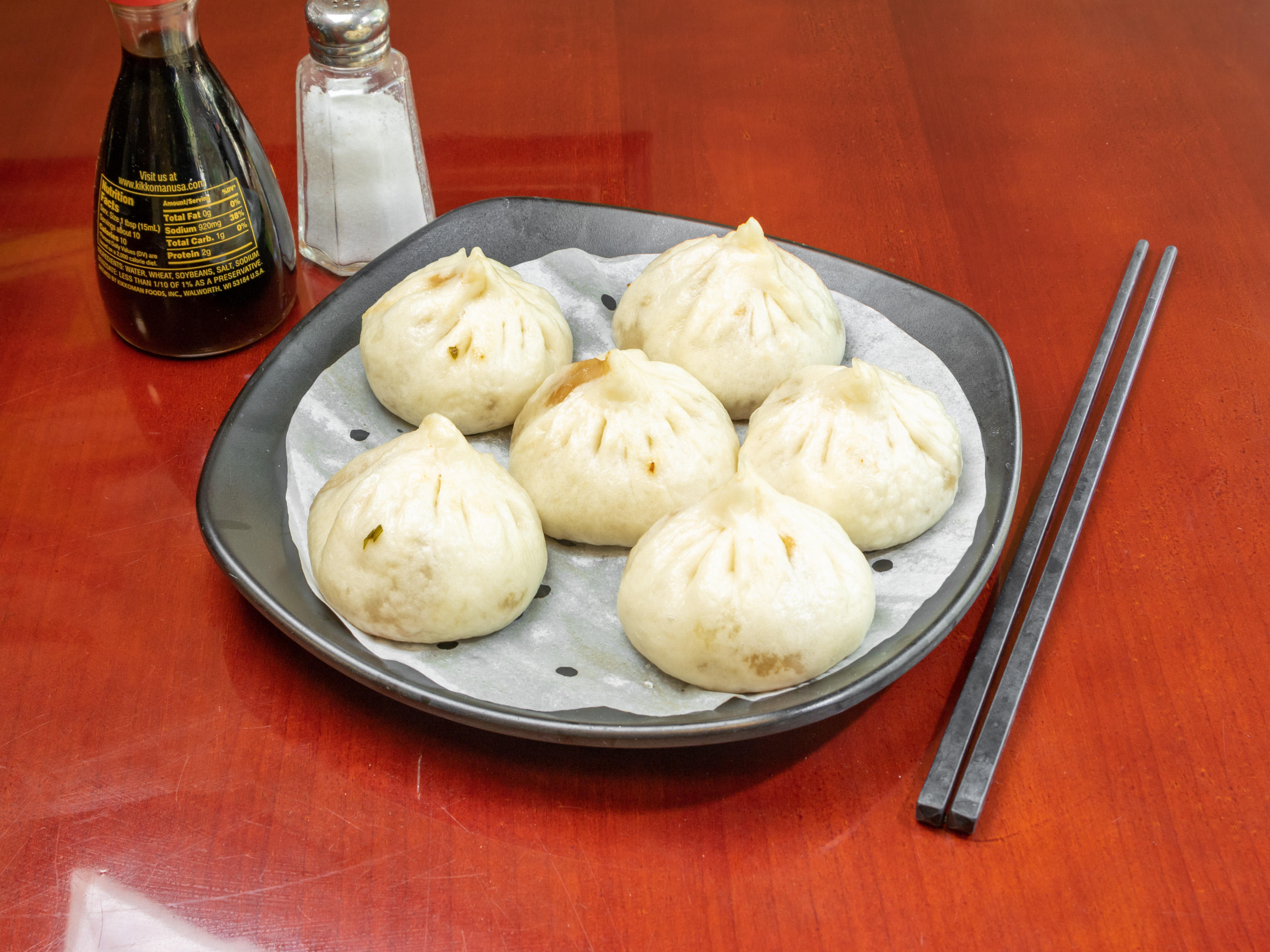 Order Steamed Pork Dumplings（6pcs） 鲜肉小笼包 food online from Osaka House store, Madison on bringmethat.com