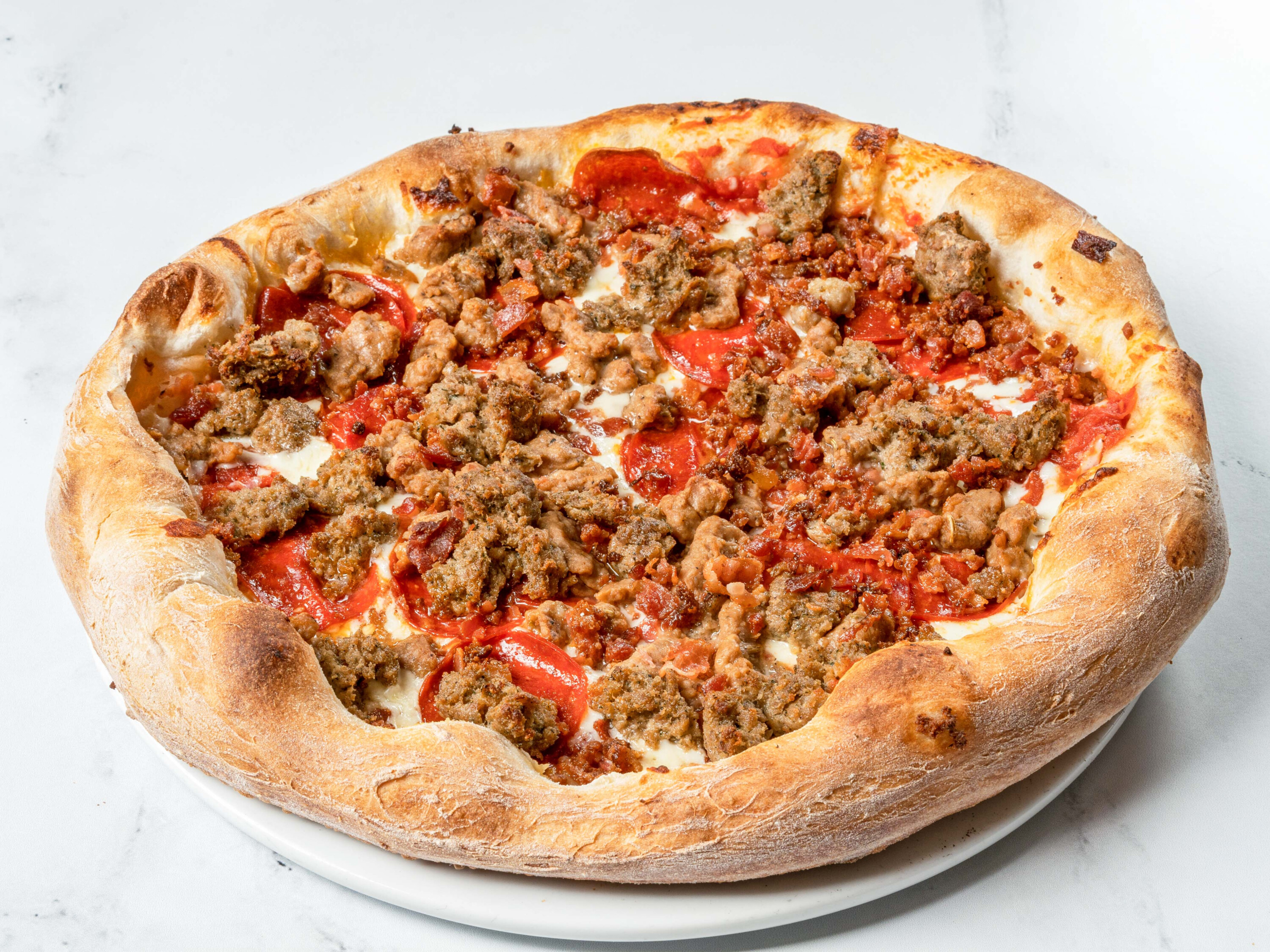 Order Meatlovers Pizza food online from Salvatore's Restaurant store, Lawrence on bringmethat.com