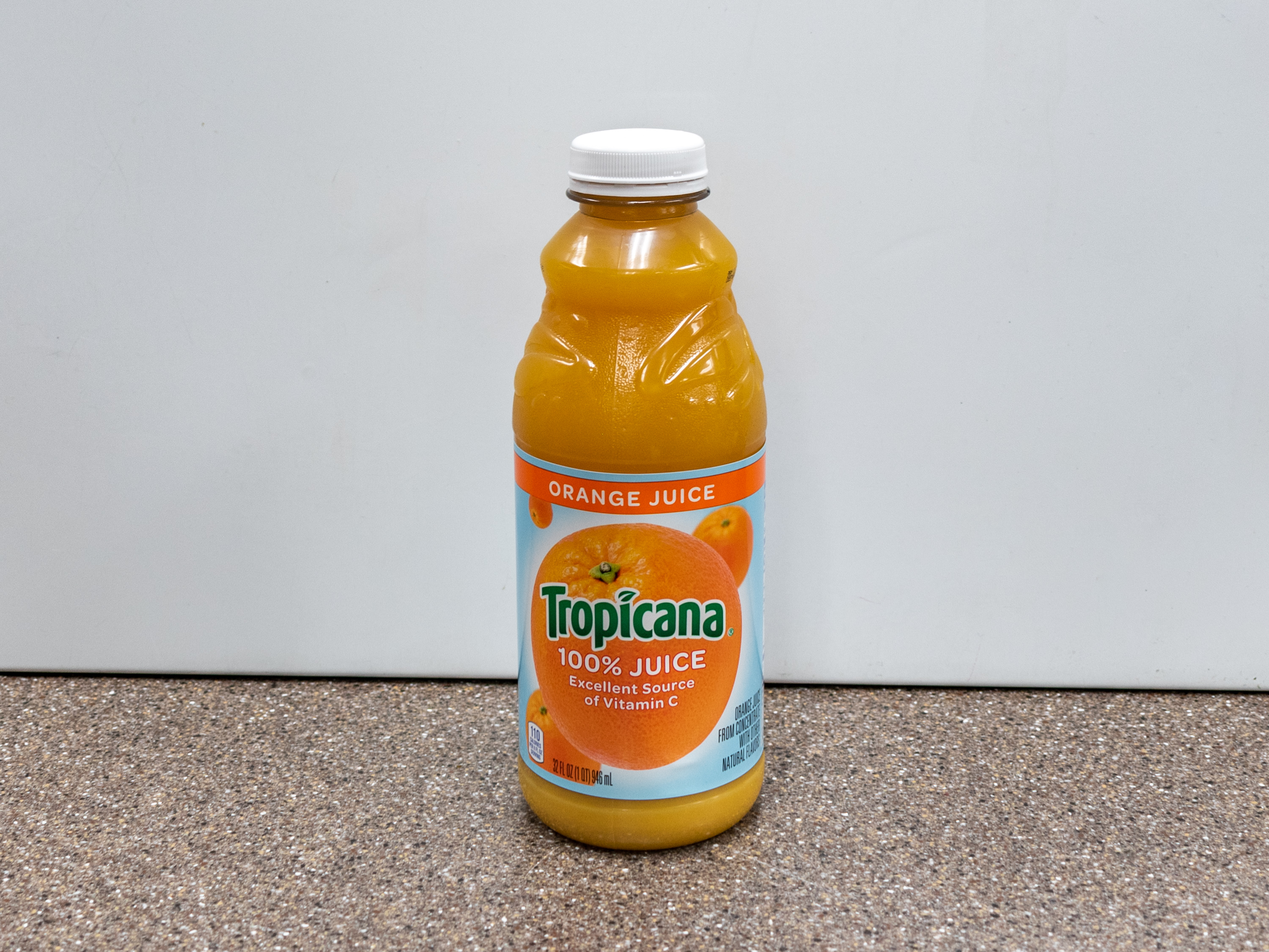 Order Tropicana Orange Juice 32 oz. food online from Kangaroo Food Mart store, Cathedral City on bringmethat.com