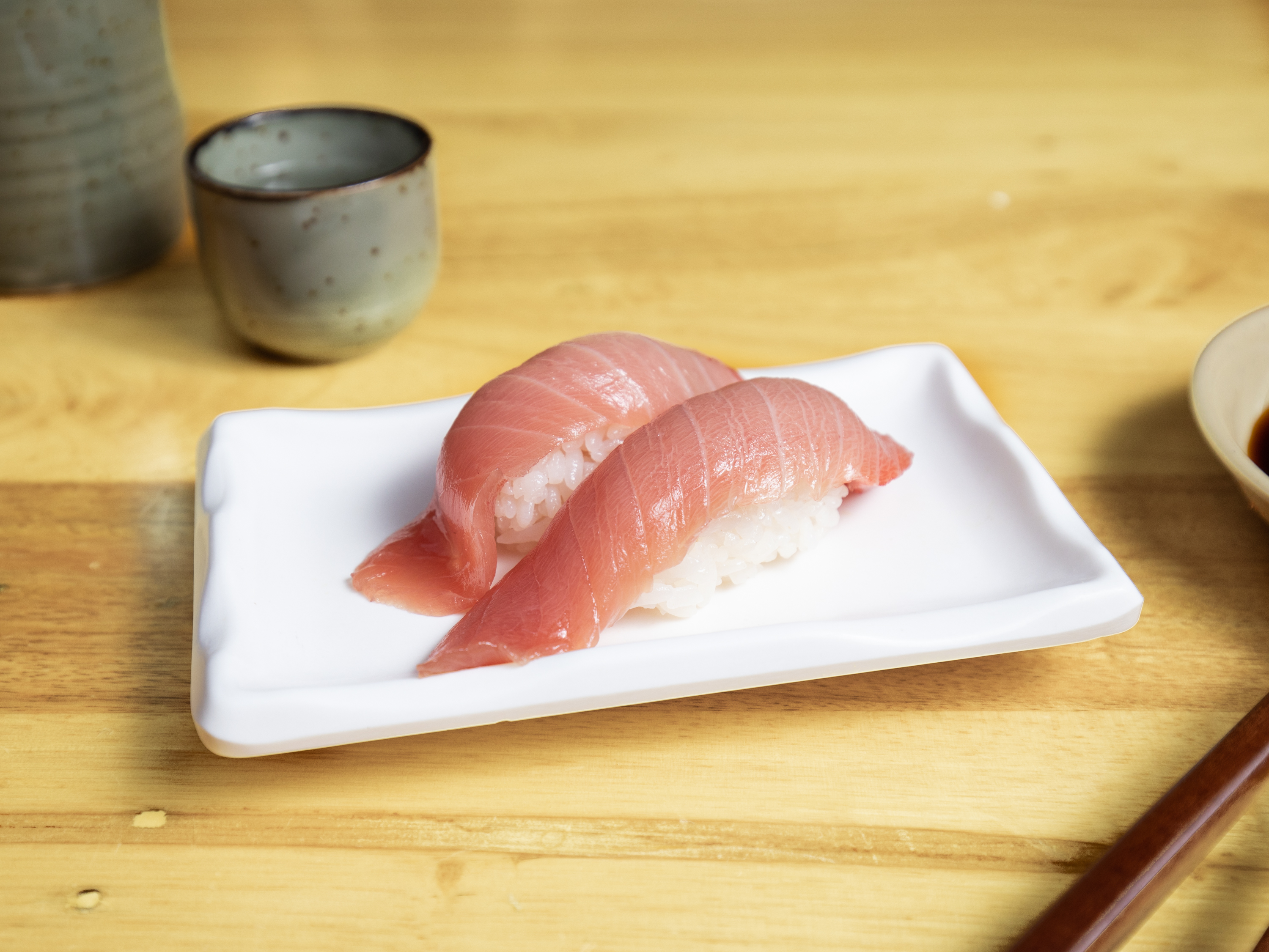 Order Tuna Nigiri food online from Izakaya Mayumi store, San Francisco on bringmethat.com