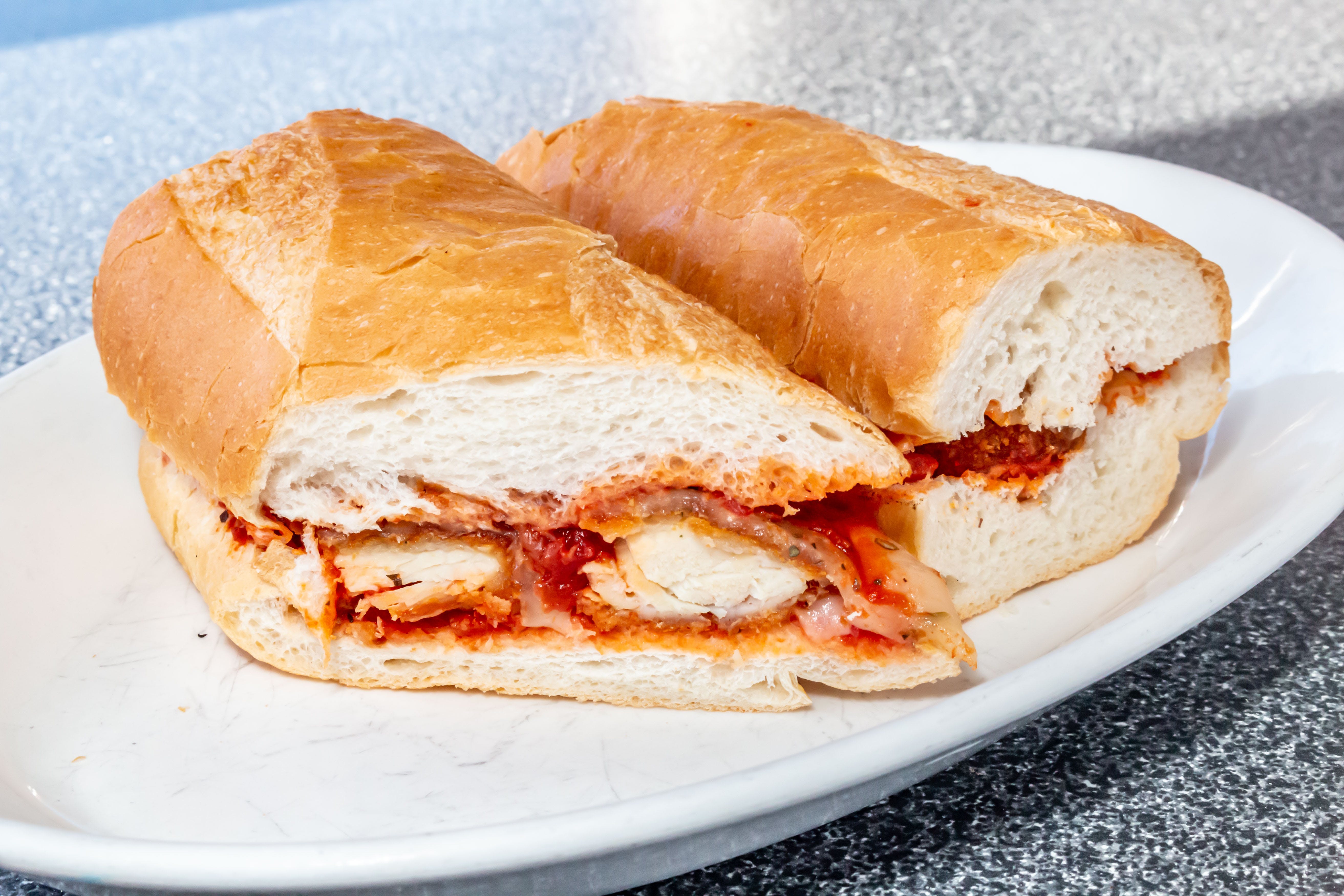 Order Chicken Parmesan Sandwich - Sandwich food online from Mario's Pizza store, Northbrook on bringmethat.com