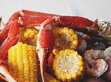 Order c# Crab & Shrimp Feast  (Snow Clusters,  (10) Shrimp, Potato Wedges, Corn Cobs, Butter & Old Bay) food online from Chicken Delight store, Rahway on bringmethat.com