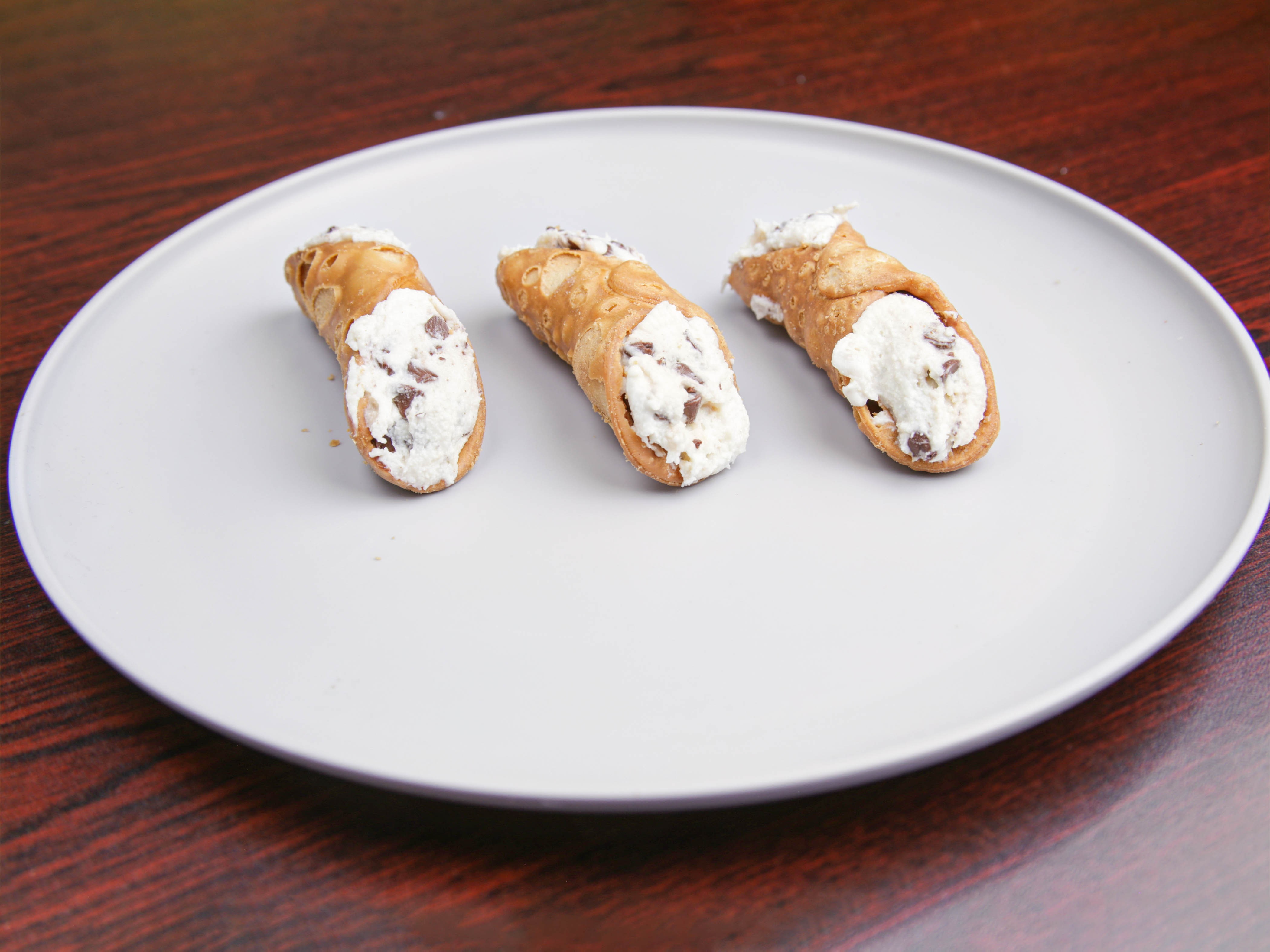 Order Cannoli food online from Rino D's Pizza & Wings store, Gilbert on bringmethat.com
