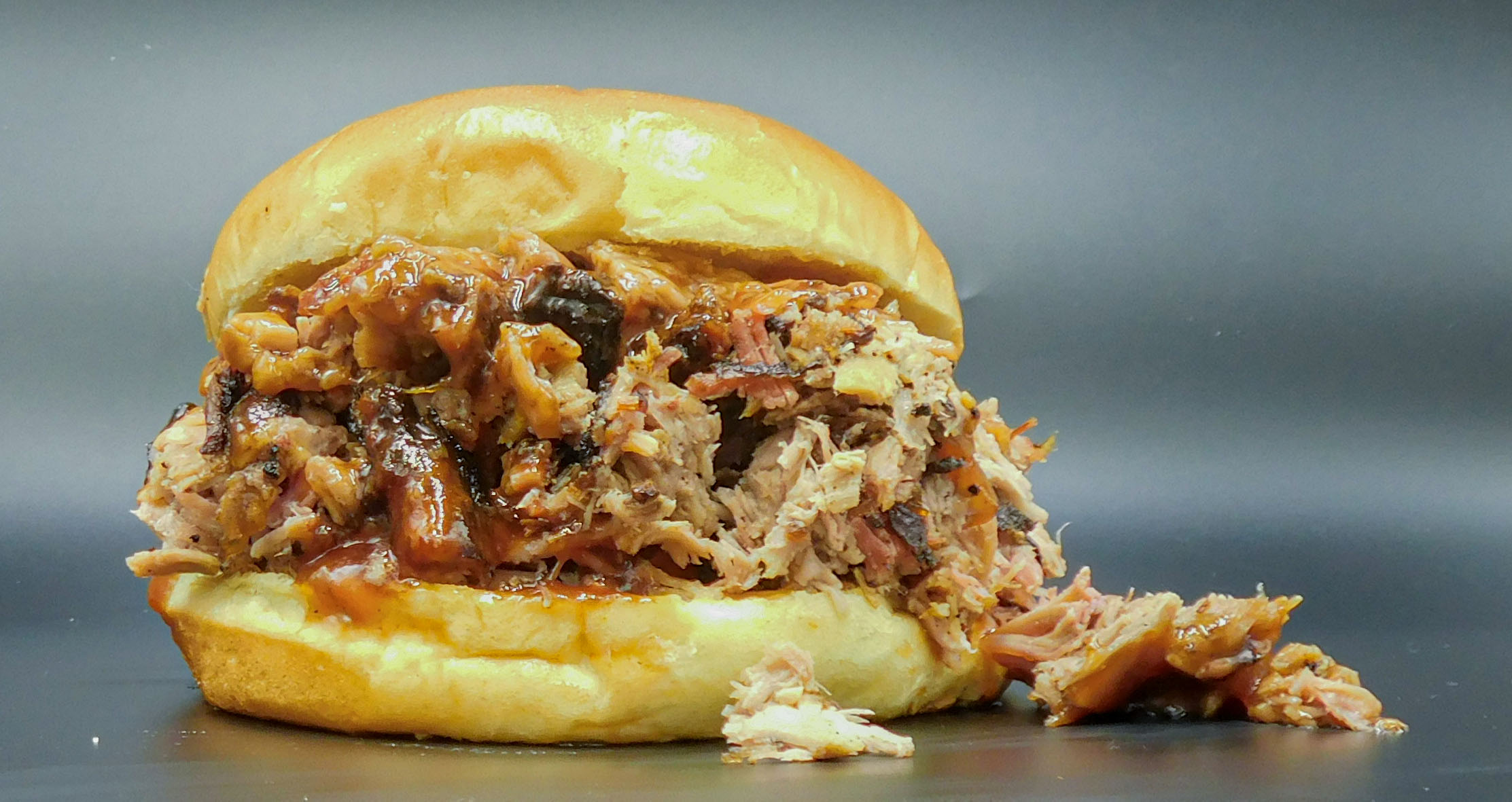 Order BBQ Pulled Pork Sandwich food online from Pit Rib House store, Hickory Hills on bringmethat.com
