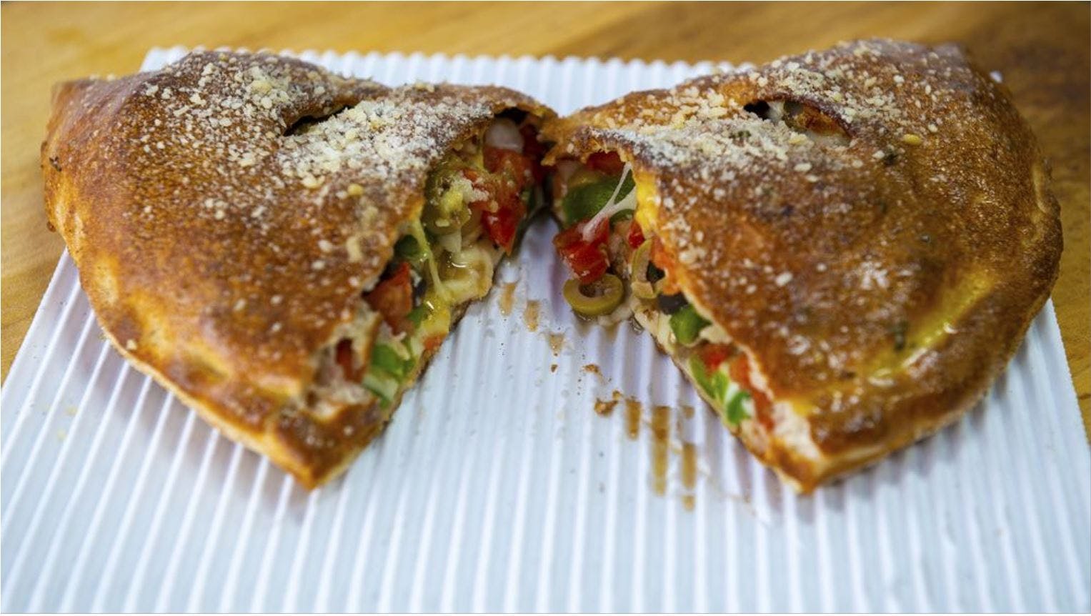 Order Veggie Calzone - Calzone food online from Benito's Pizza store, Ypsilanti on bringmethat.com