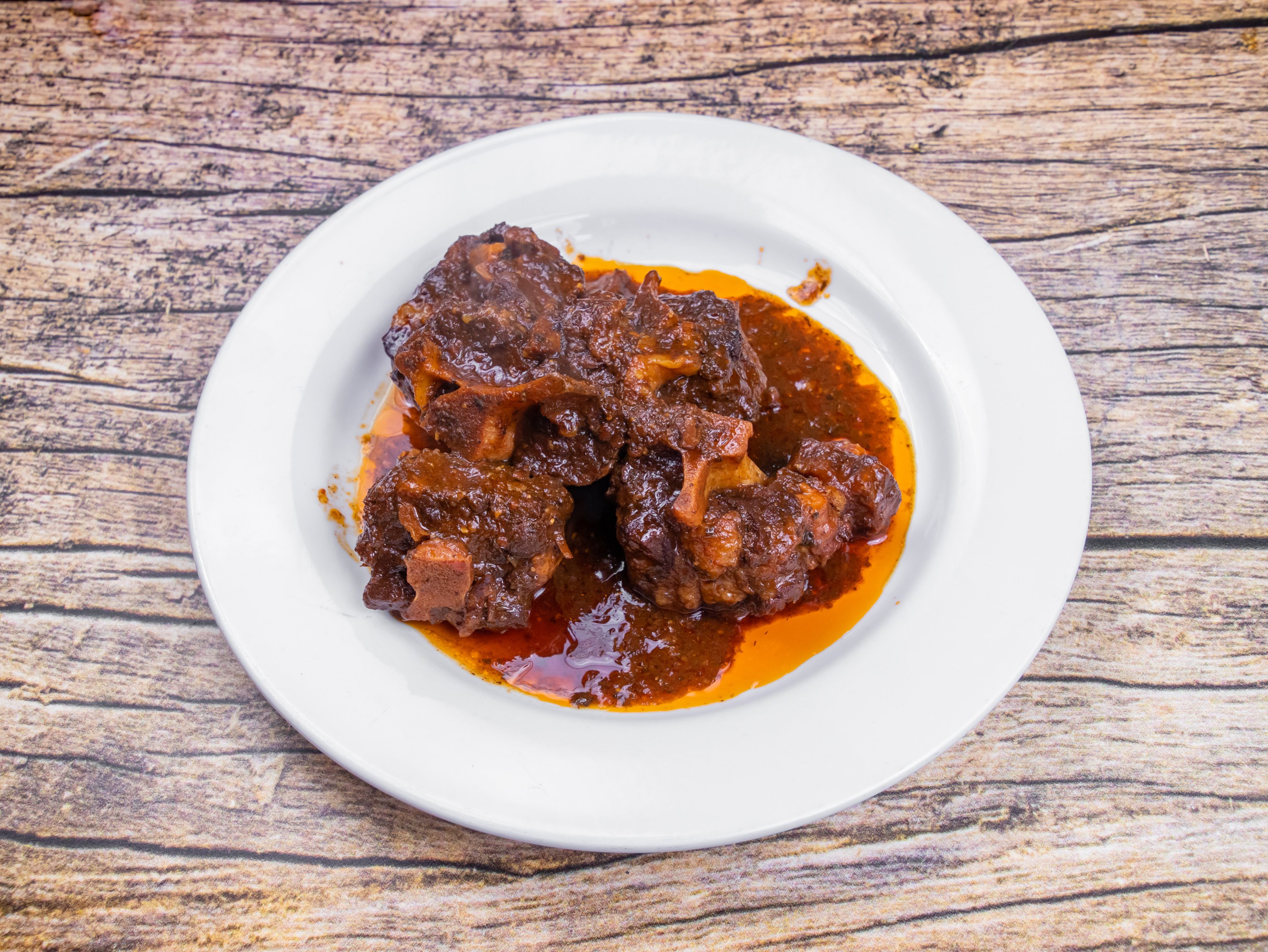 Order Oxtails food online from Lyons Jamaican Cuisine Llc store, Norcross on bringmethat.com