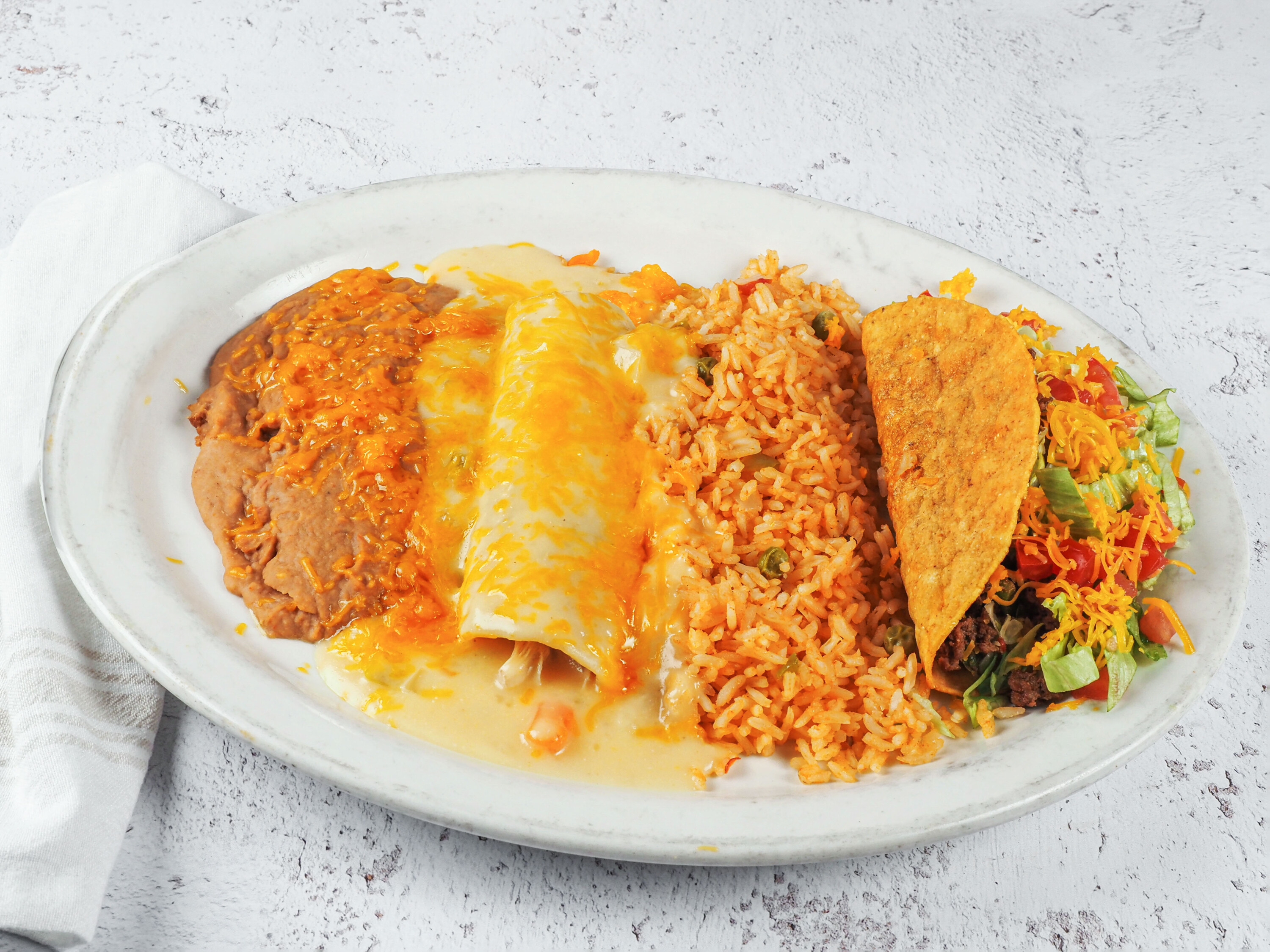 Order 9. One Enchilada and 1 Taco Lunch Special food online from Zapata Mexican Grill store, Oklahoma City on bringmethat.com