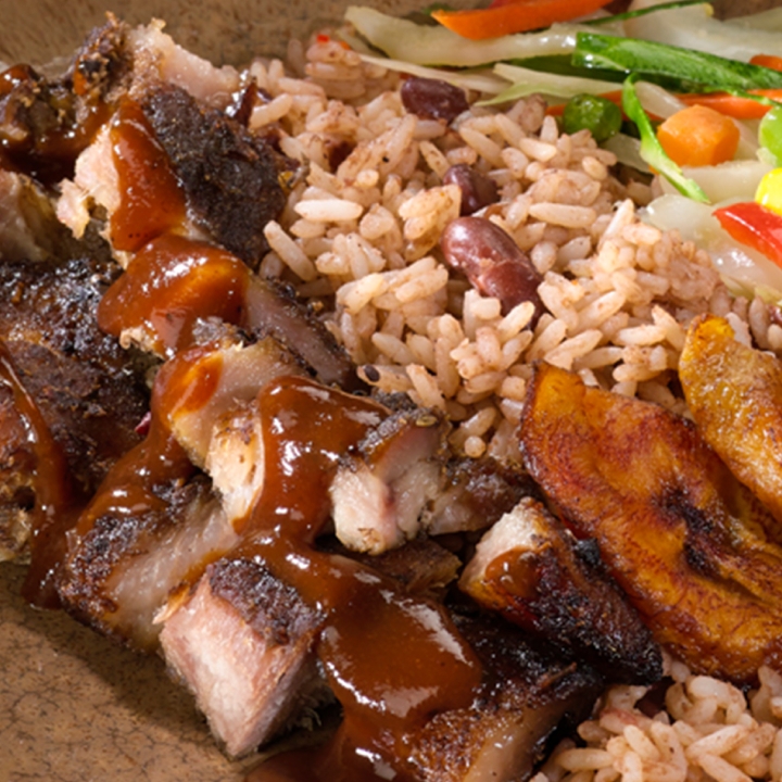 Order Jerk Pork food online from Golden Krust Caribbean Restaurant store, Mattapan on bringmethat.com