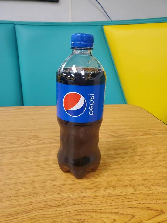 Order Regular Bottle Pepsi 20 OZ food online from Jamaican Cafe Cuisine store, Newark on bringmethat.com