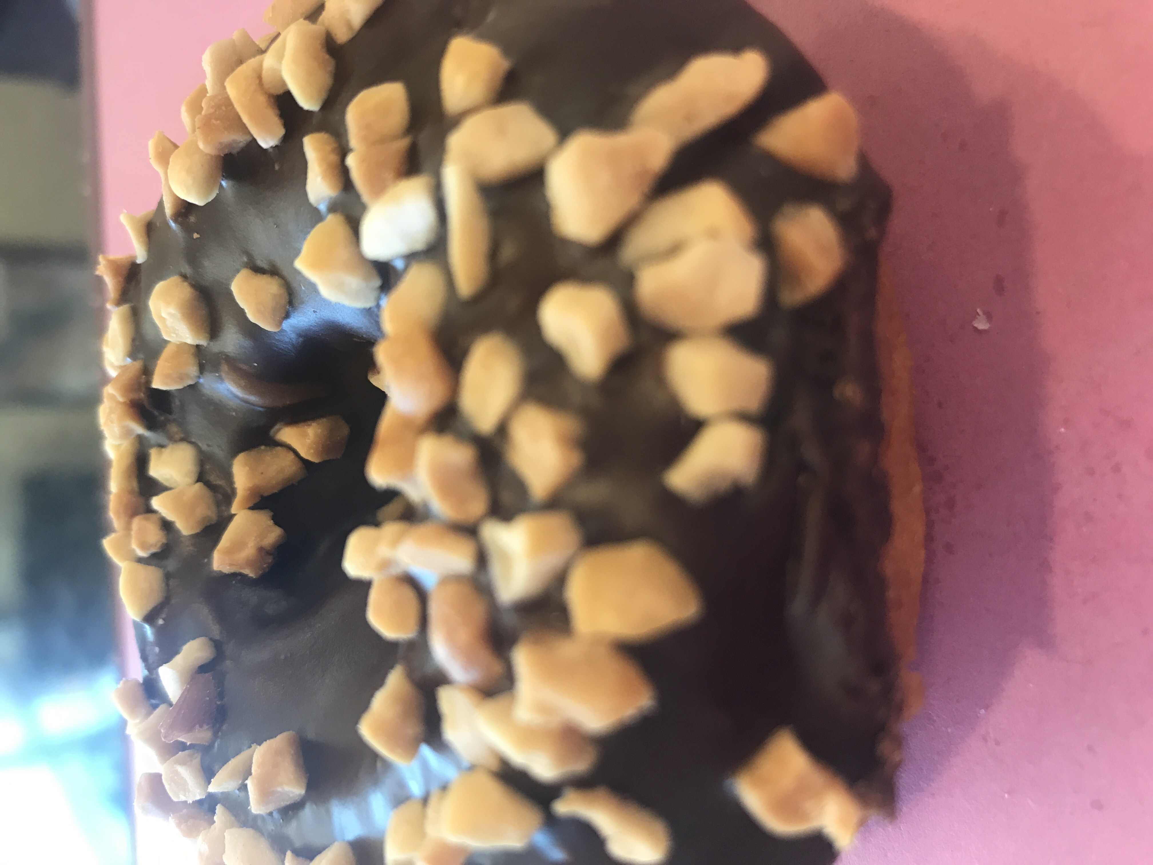 Order White Cake Donut with Chocolate Icing and Peanuts food online from Angel Panama Lane Donuts store, Bakersfield on bringmethat.com