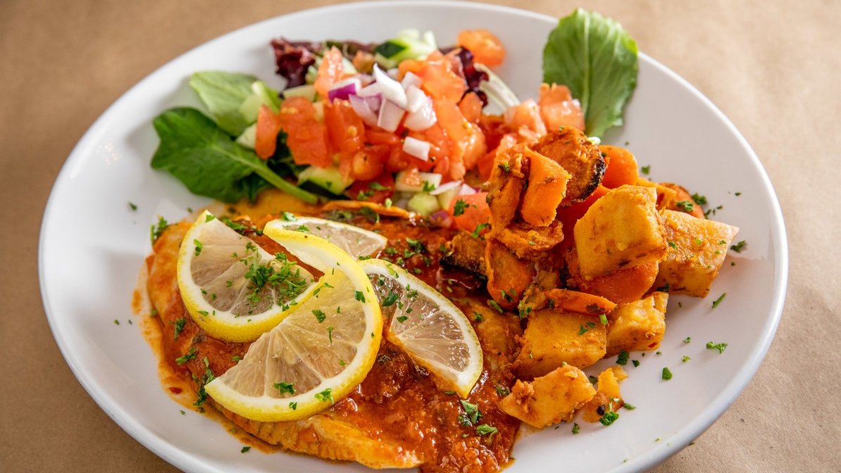 Order Spicy Moroccan Fish food online from Effy's Cafe store, New York on bringmethat.com