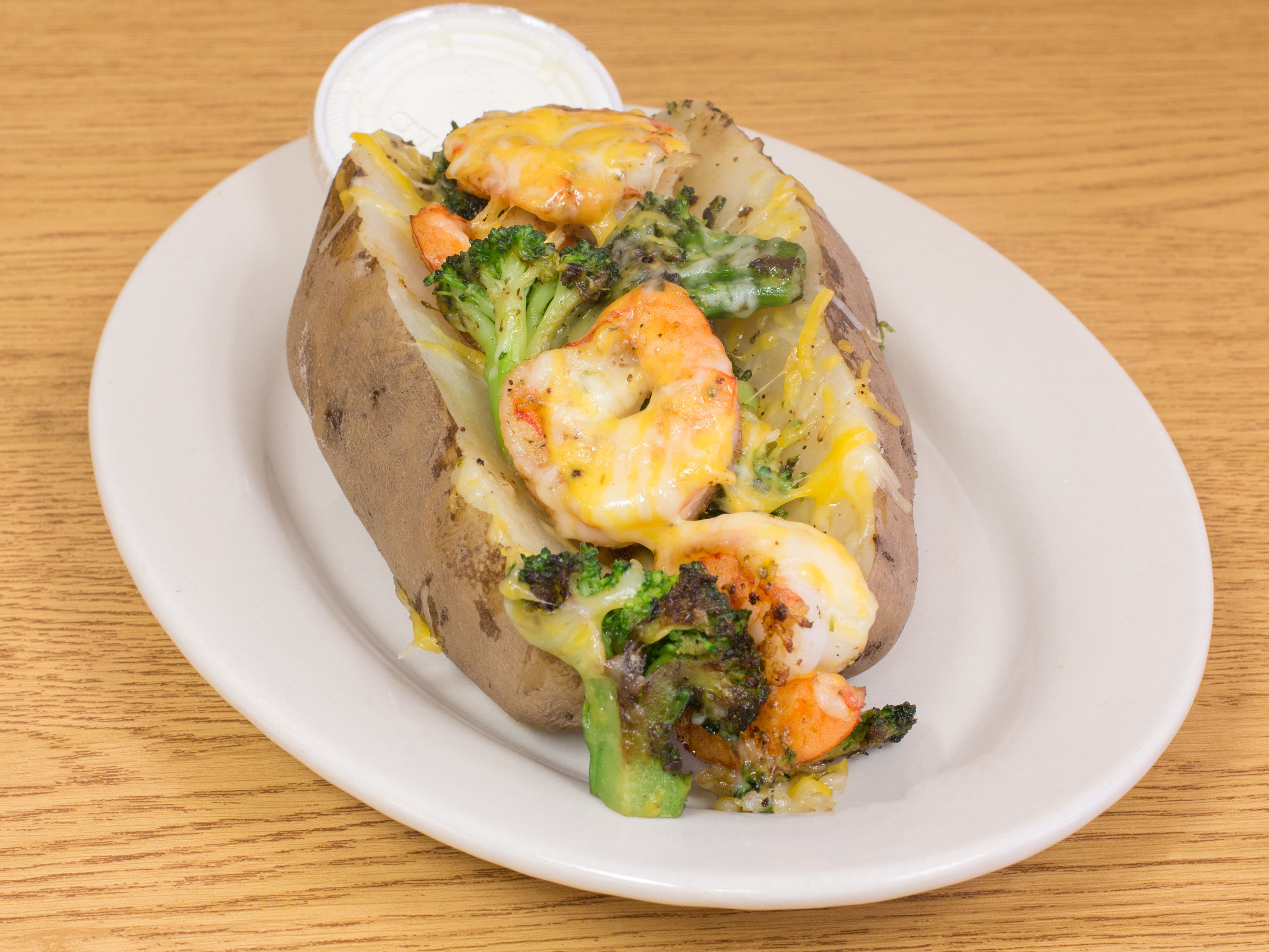 Order Broccoli and Cheese Baked Potato food online from Clinton Eatery store, Newark on bringmethat.com