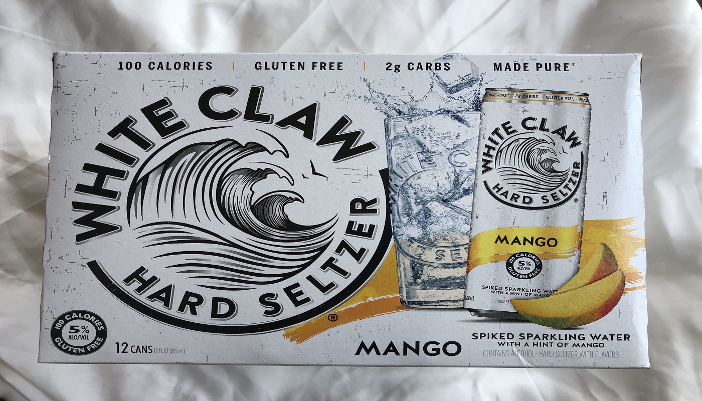 Order White Claw Hard Seltzer Mango 6 Pack 12 oz. Cans food online from Village Wine & Spirits store, Ventura on bringmethat.com