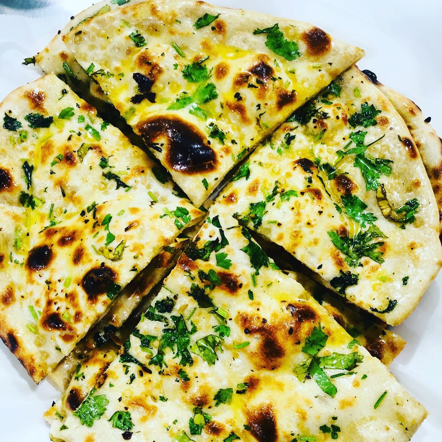 Order  Garlic Naan food online from The Amarvilas store, Stockton on bringmethat.com