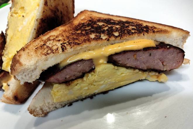Order Andouille Sausage Egg & Cheese Sandwich food online from AGAPE KITCHEN & PRALINES store, Humble on bringmethat.com