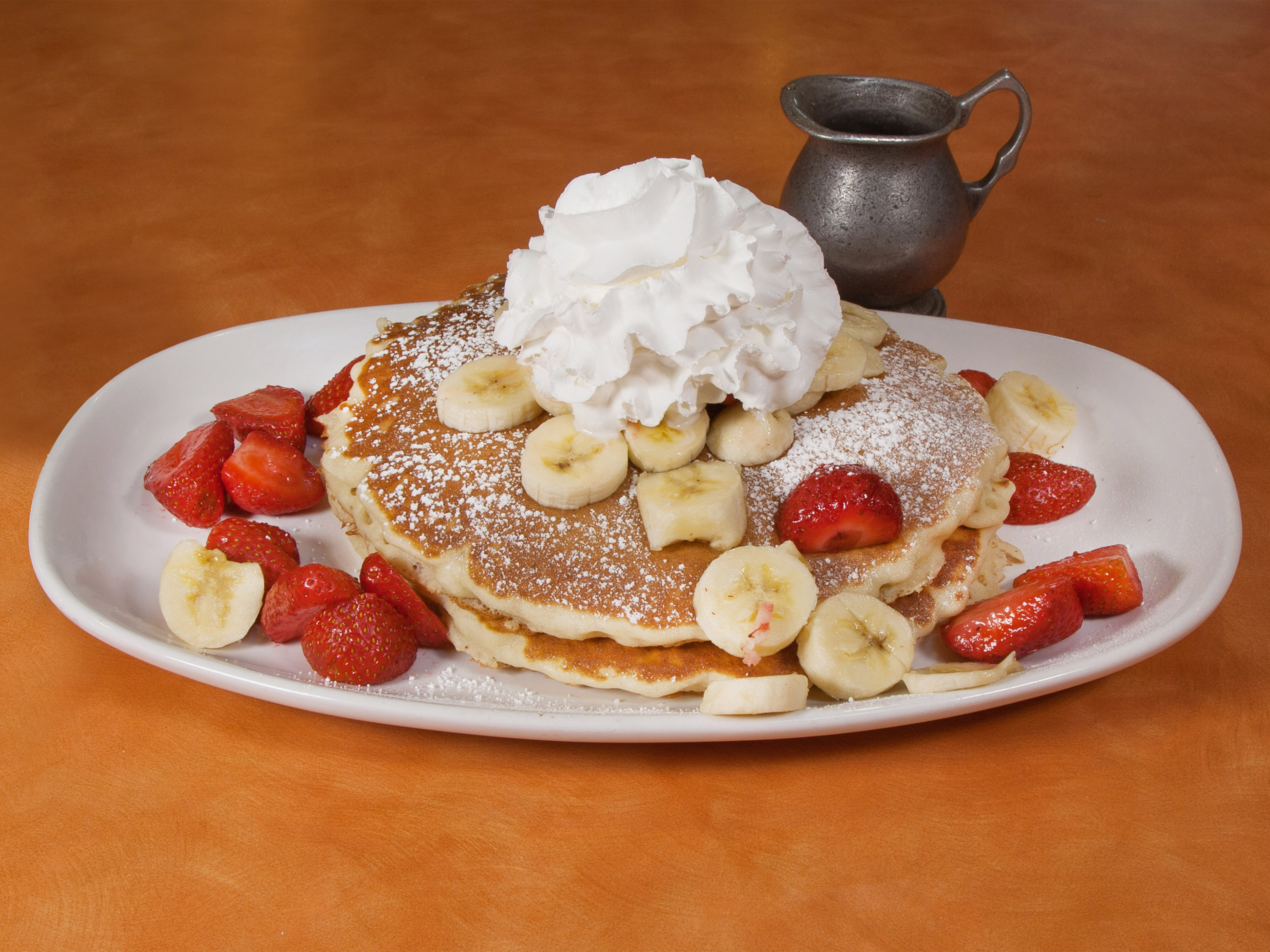 Order Strawberry Banana Pancakes food online from Yia Yia Pancake House store, North Riverside on bringmethat.com