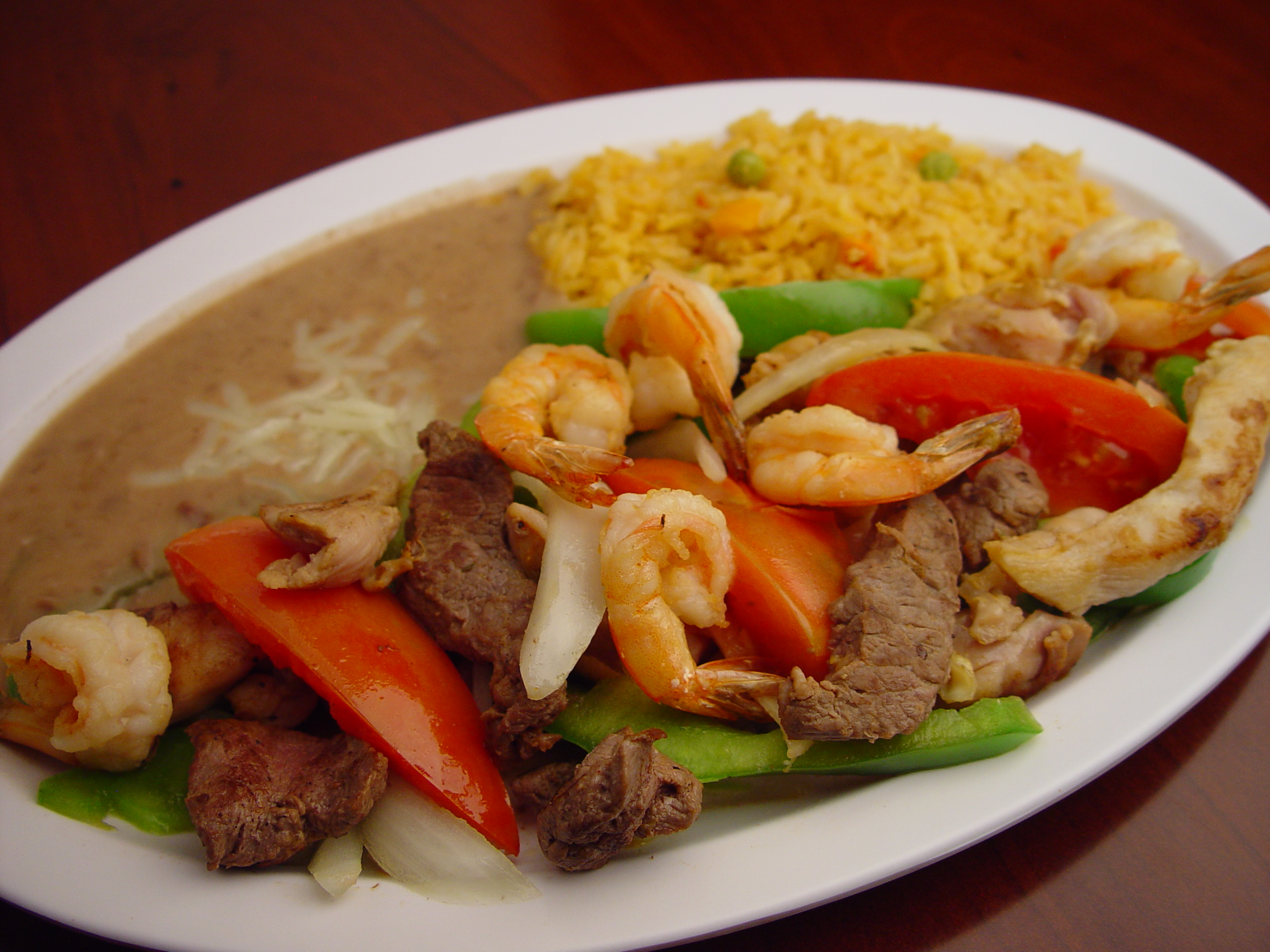 Order 59. Steak and Shrimp Fajitas food online from Rodeo Mexican Grill store, Los Angeles on bringmethat.com