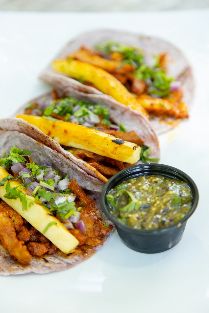 Order Tacos Al Pastor (2) food online from Totopos store, Cary on bringmethat.com