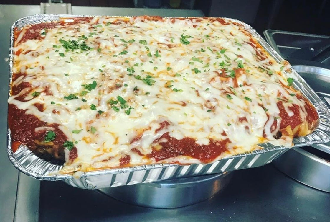 Order Lasagna Party Platters Catering - 1/2 Tray (Serves 10) food online from Italia Pizza store, El Cajon on bringmethat.com