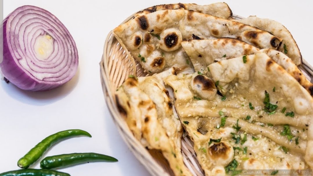 Order Garlic Naan food online from Biryani Hub store, Norfolk on bringmethat.com
