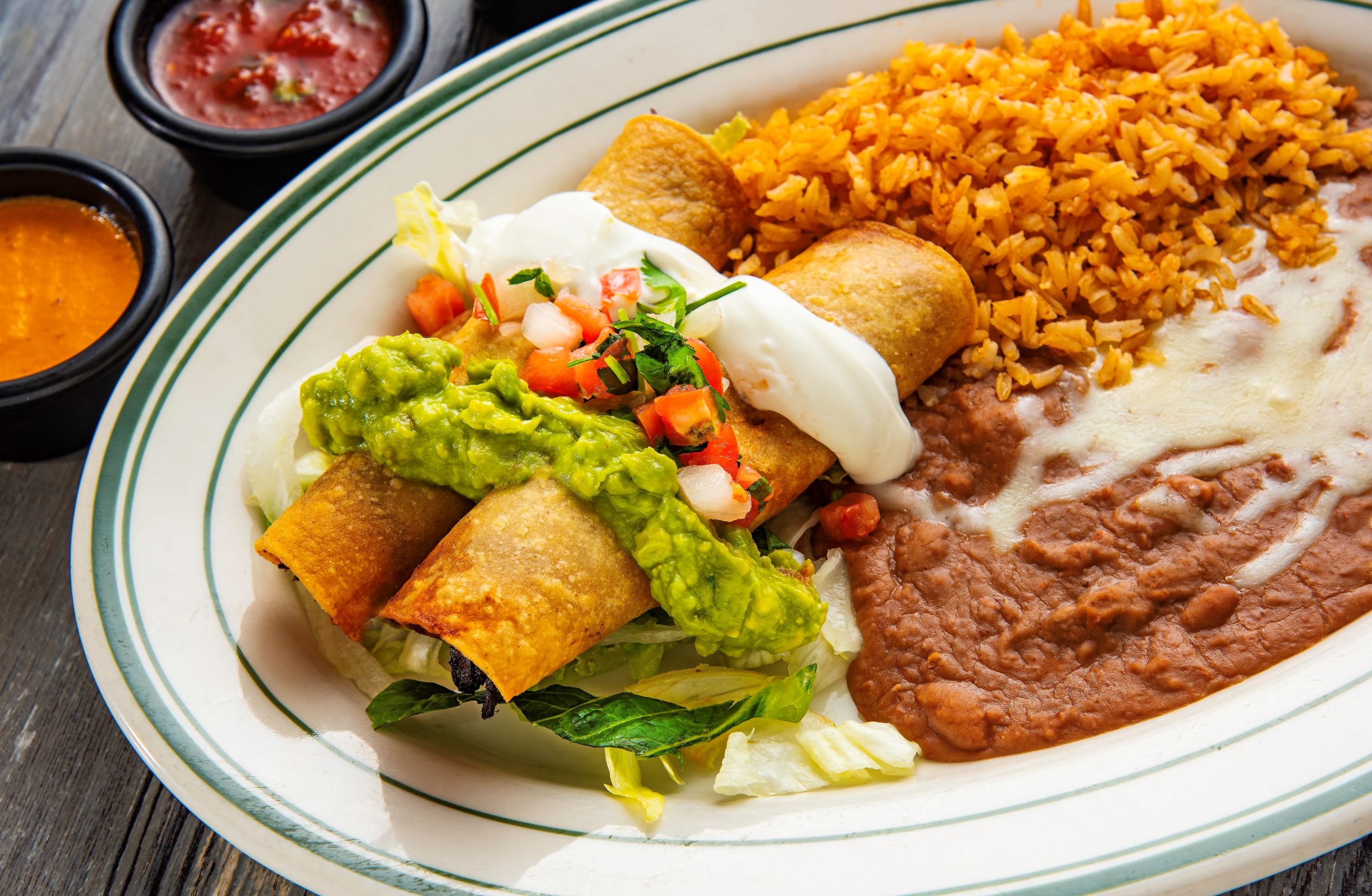 Order 9. Two Flautas Combination food online from Los Tres Chiles store, Santa Rosa on bringmethat.com