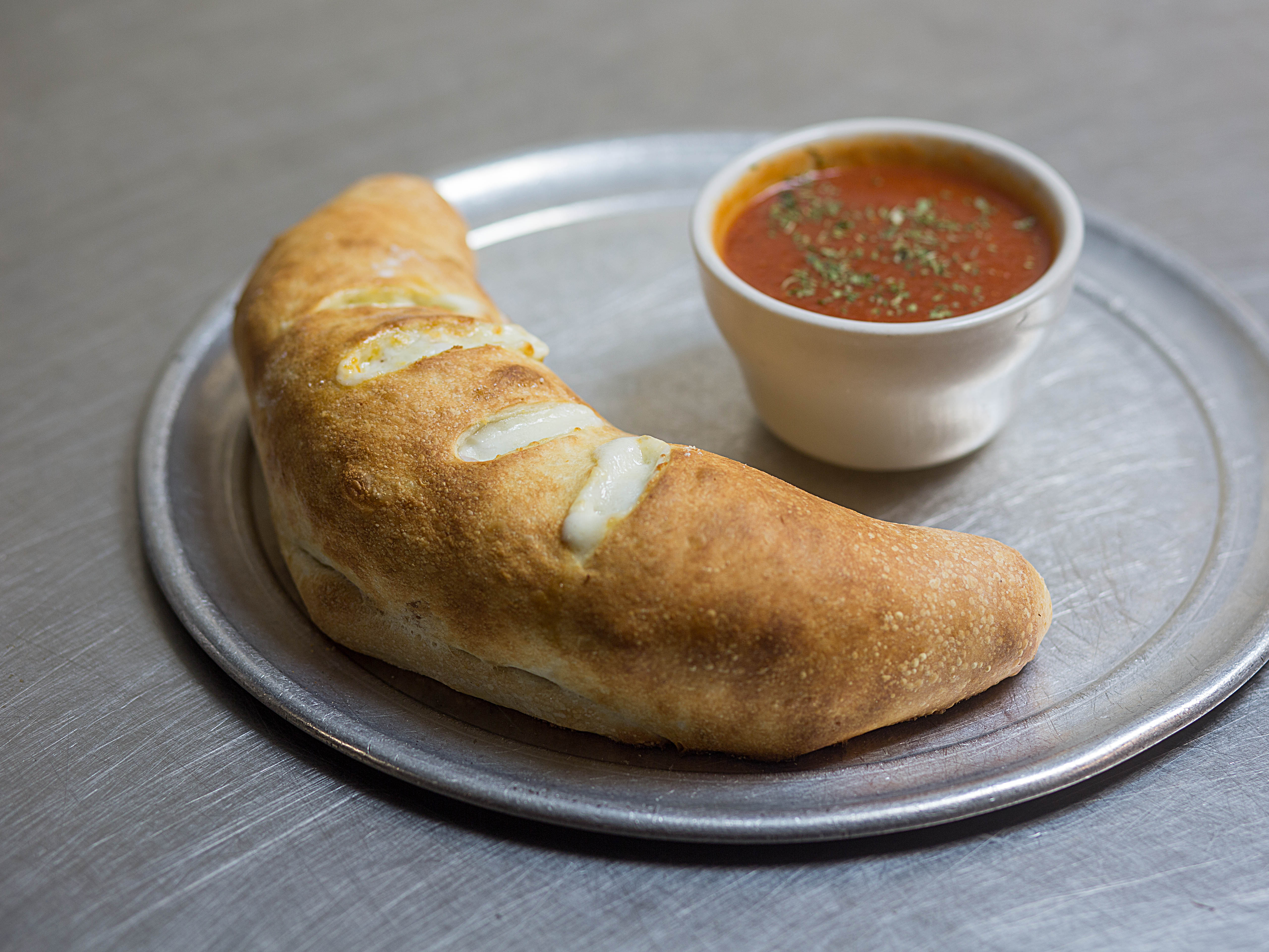 Order Traditional Stromboli food online from Doughboys Pizzeria & Italian Restaurant store, Fort Lauderdale on bringmethat.com