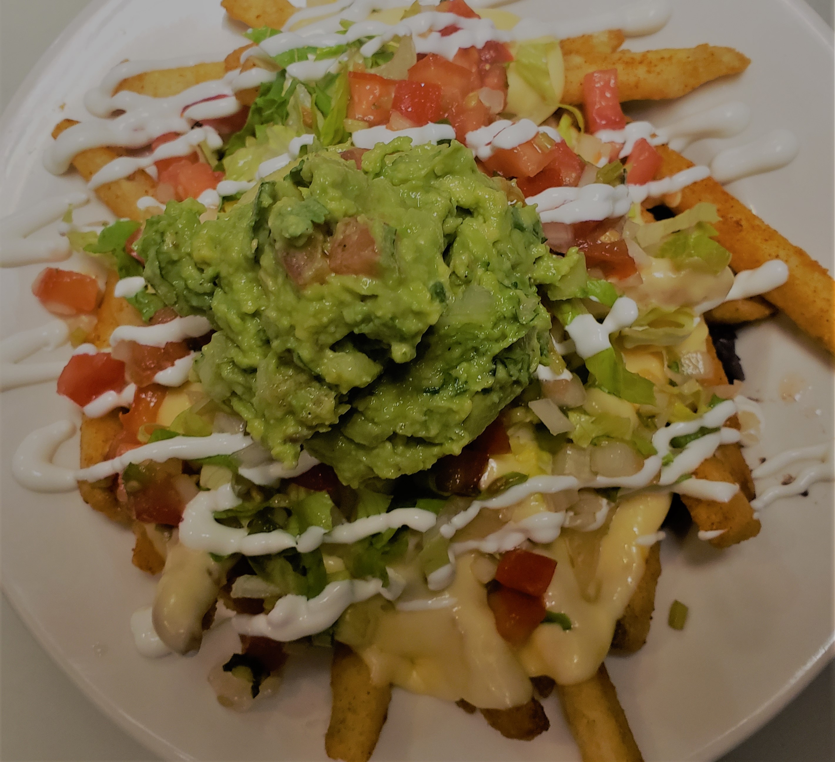 Order Nacho fries food online from Quetzally Mexican Food store, Philadelphia on bringmethat.com
