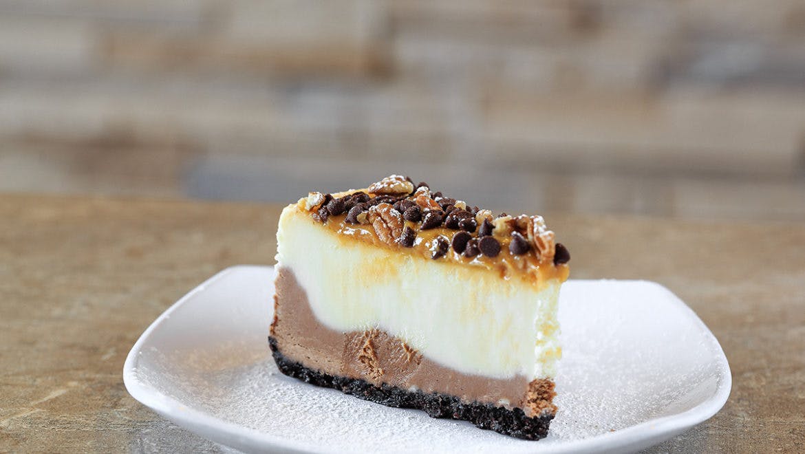 Order Caramel Turtle Cheesecake - Dessert food online from Palios Pizza Cafe store, Colleyville on bringmethat.com