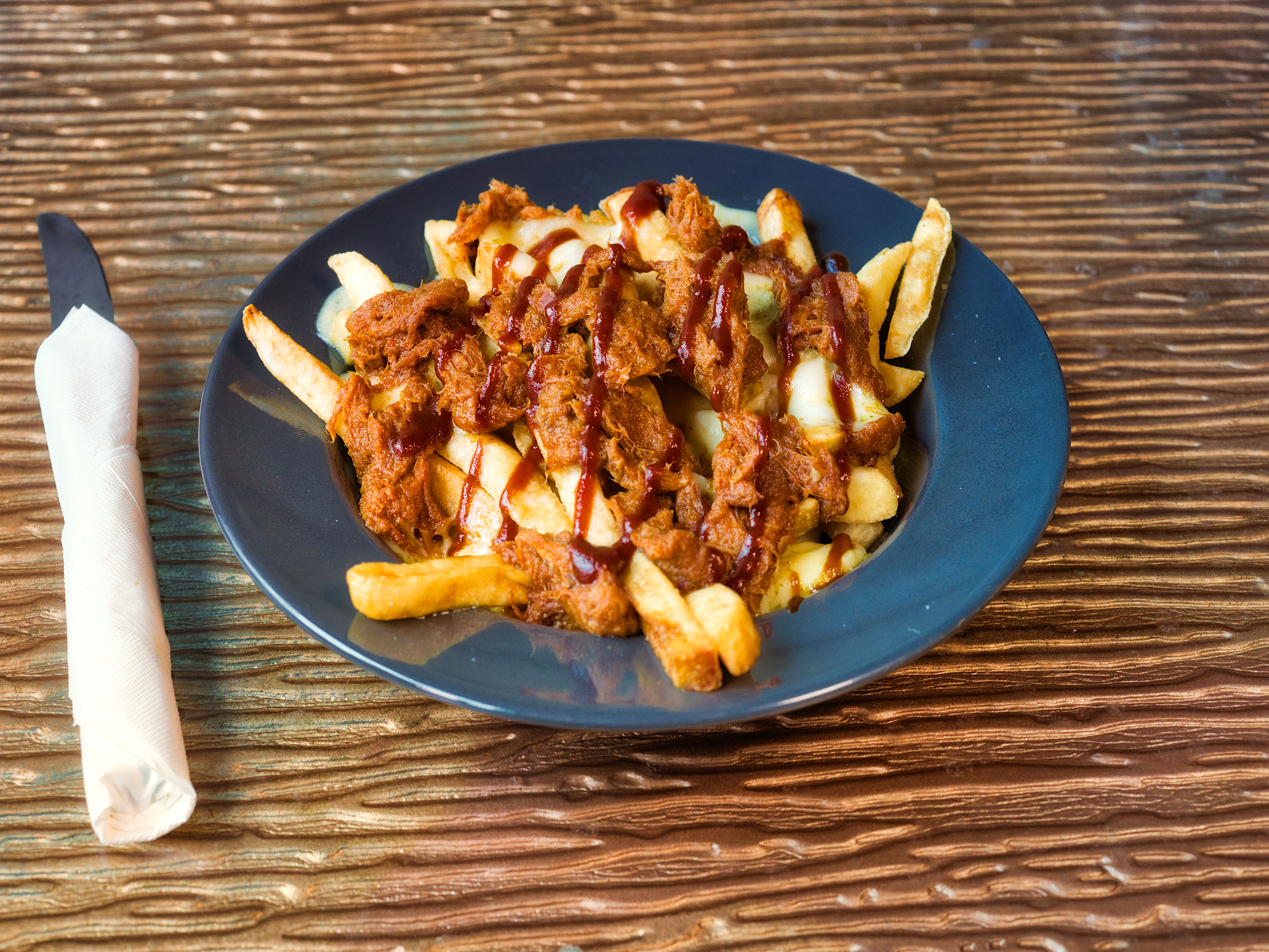 Order Central Pork - Poutine food online from Liberty Bar & Poutinerie store, Pontiac, MI on bringmethat.com
