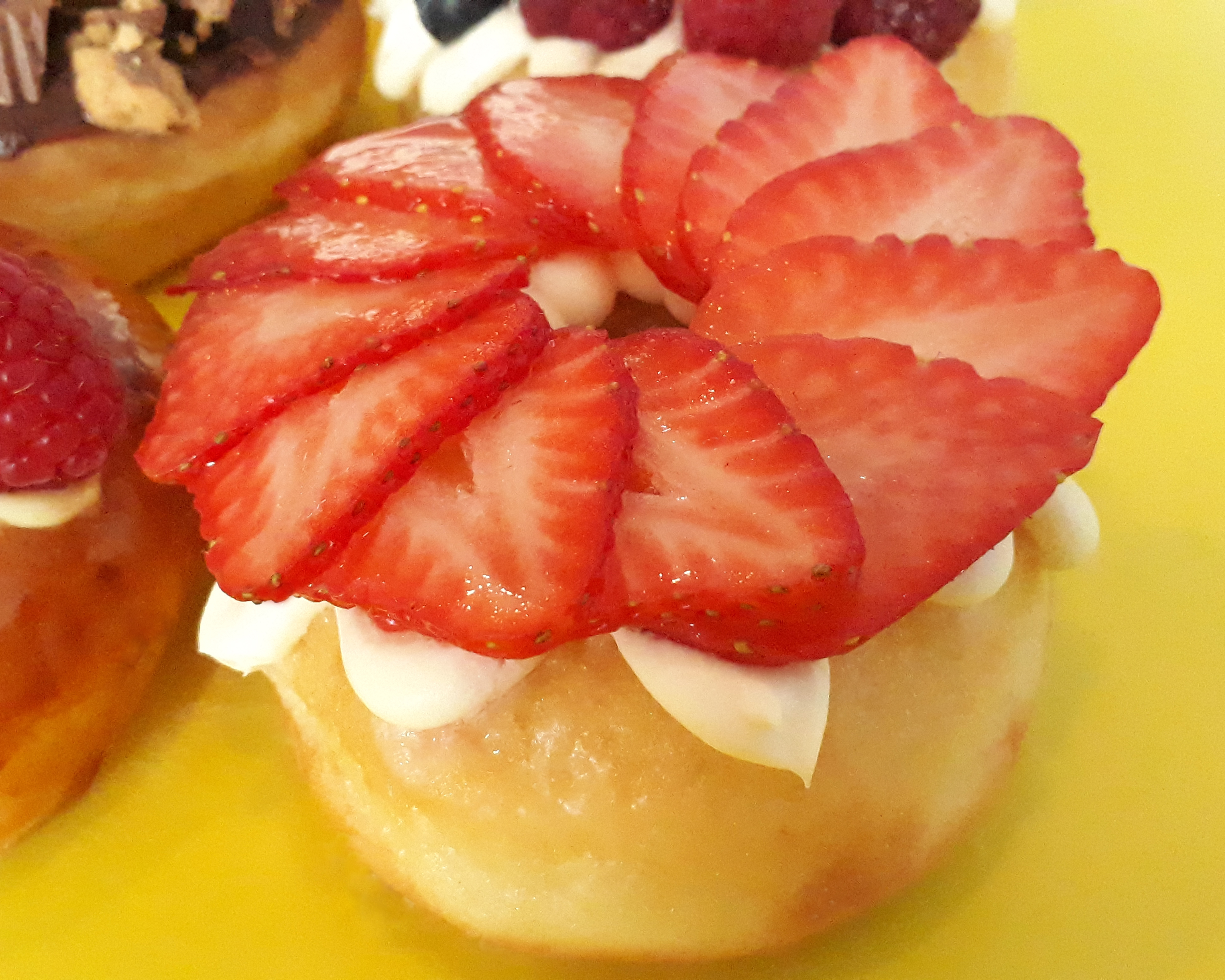 Order Cream Cheese & Strawberry Donut food online from Jaram's Donuts store, Dallas on bringmethat.com