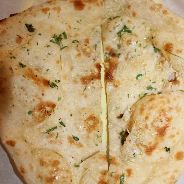 Order Garlic Naan food online from Red chilli store, San Francisco on bringmethat.com