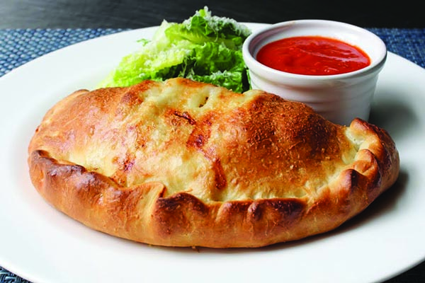 Order Meat Calzone food online from Umberto Pizzeria store, Bellmore on bringmethat.com