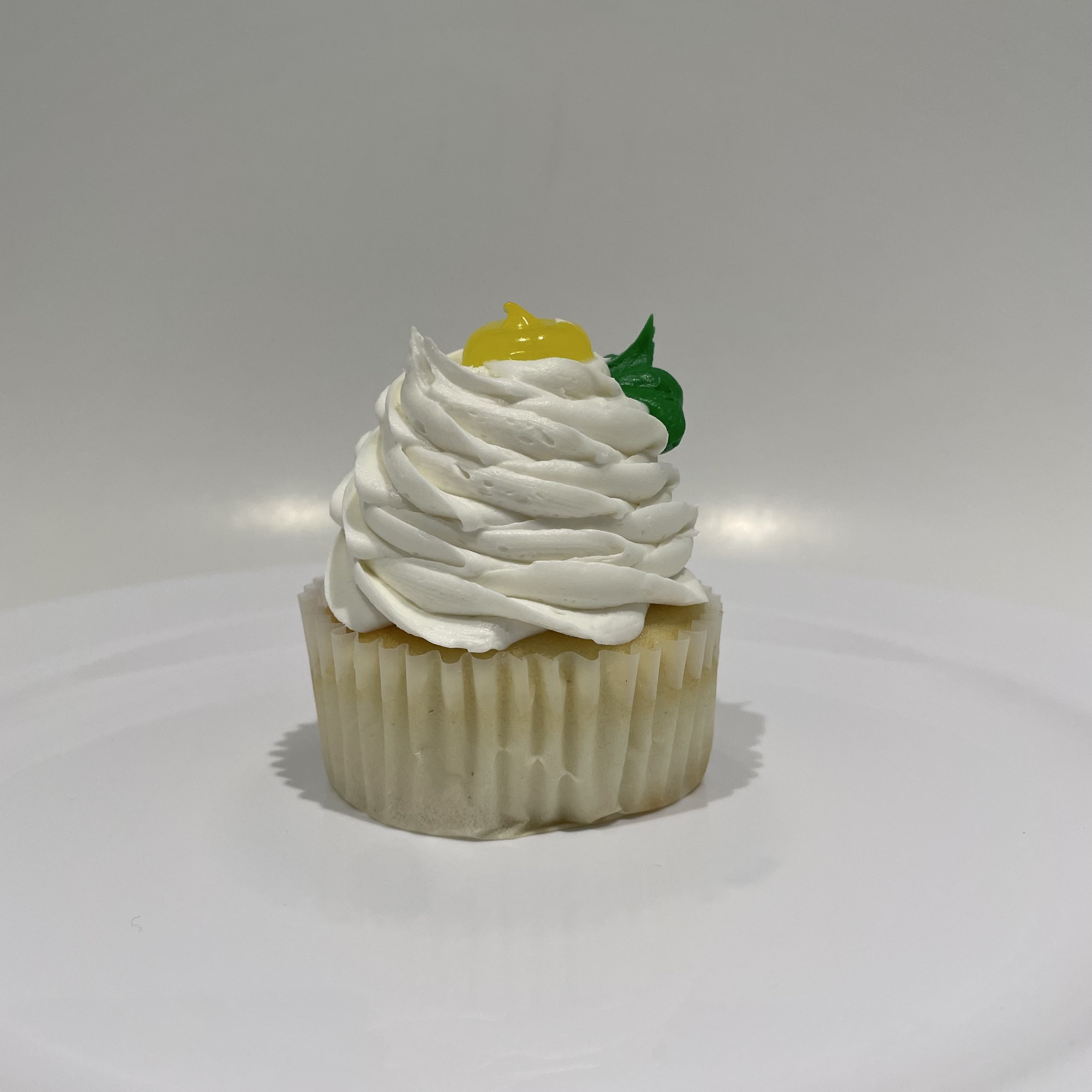 Order Lemon Burst Cupcake food online from The House of Cupcakes store, Princeton on bringmethat.com