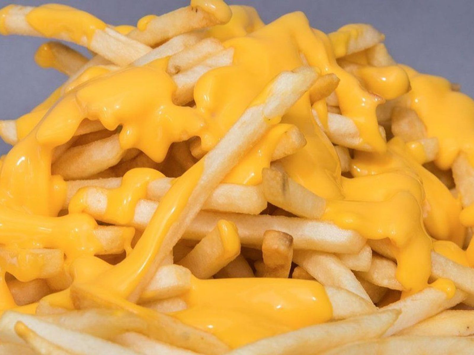 Order French Fries with Cheese food online from Leo Coney Island store, Roseville on bringmethat.com