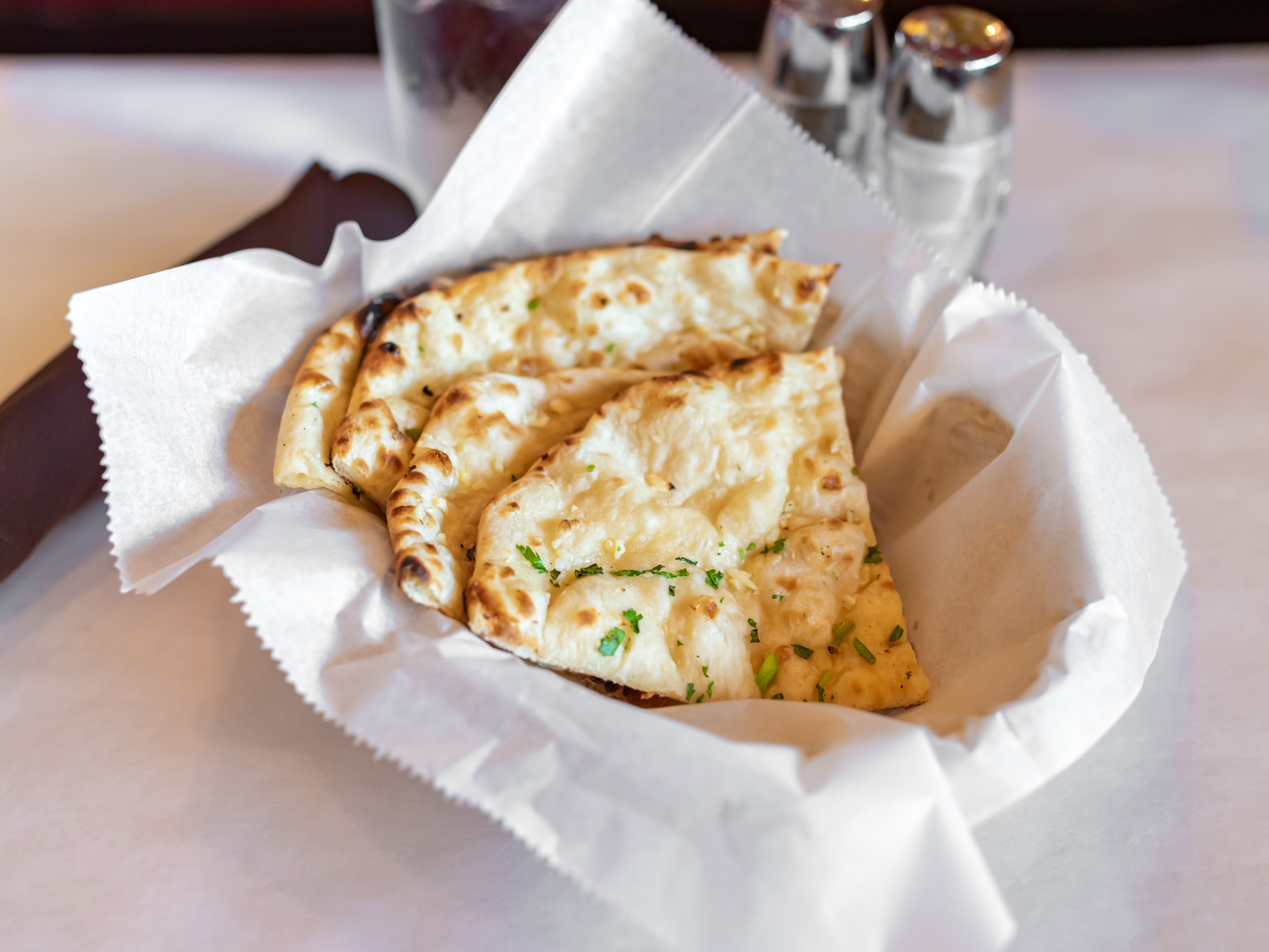 Order Garlic Naan food online from Jaipur Indian Restaurant store, Boulder on bringmethat.com
