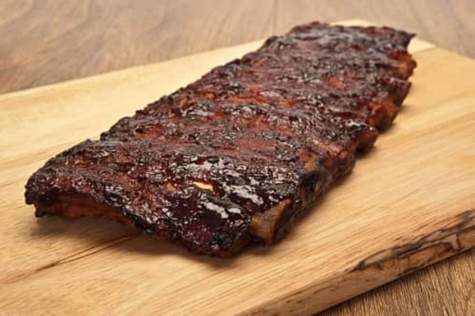 Order 1 Rack of Ribs. food online from Old Country Place store, Canton on bringmethat.com